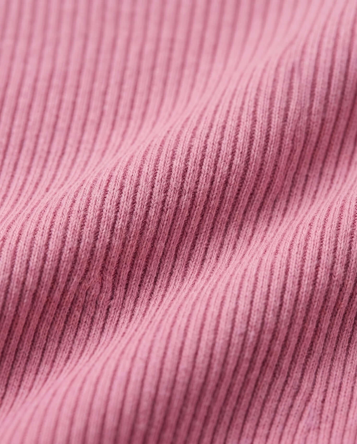 Close-up of the soft ribbed fabric in Dusty Pink Vanna Half Zip Sweater, showcasing texture and color.