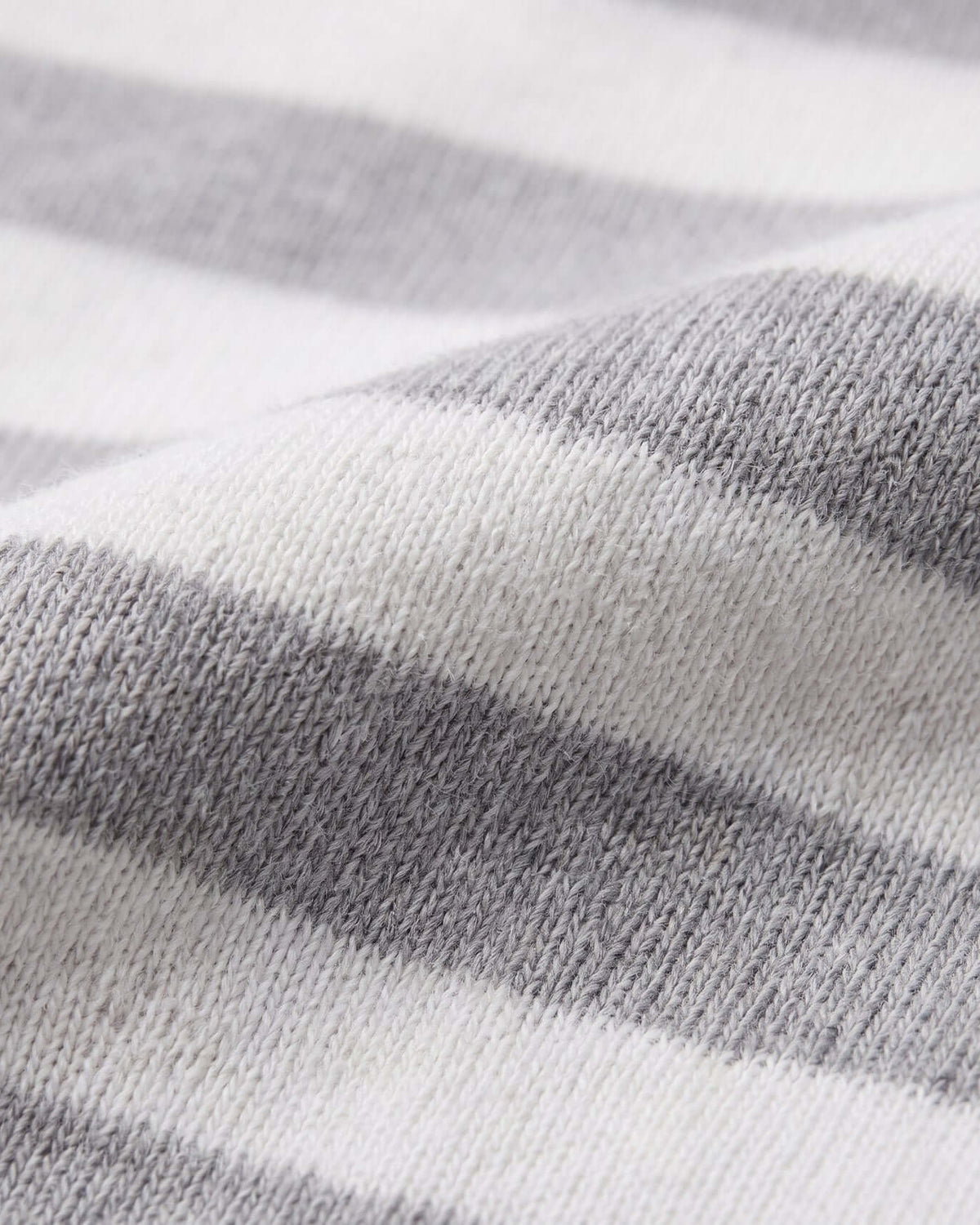 Close-up of the fabric texture showcasing the heather grey and white stripes of the Heather Grey Stripe 2-Piece Long Sleeve Pajama Set.