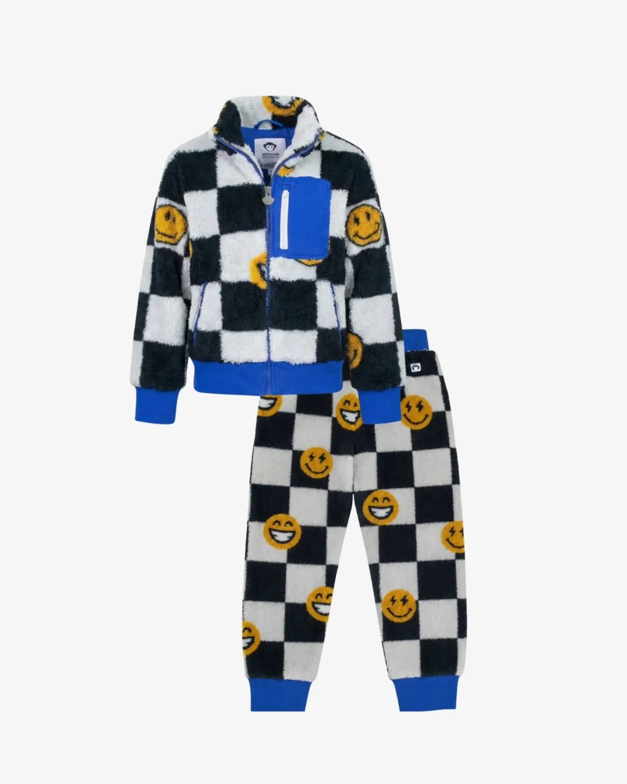 A two-piece kids' fleece tracksuit featuring a black and white checkered pattern with yellow smiley face patches, blue ribbed trim, and a matching zip-up jacket and jogger pants, shown on a light gray background.