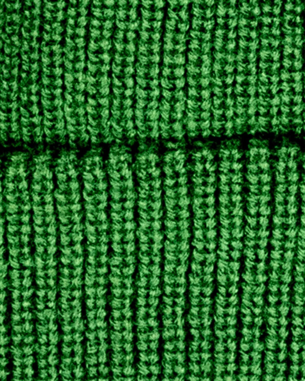 Close-up texture of the Hunter Green Haze Hat, showcasing its cozy knitted detail and vibrant green color.