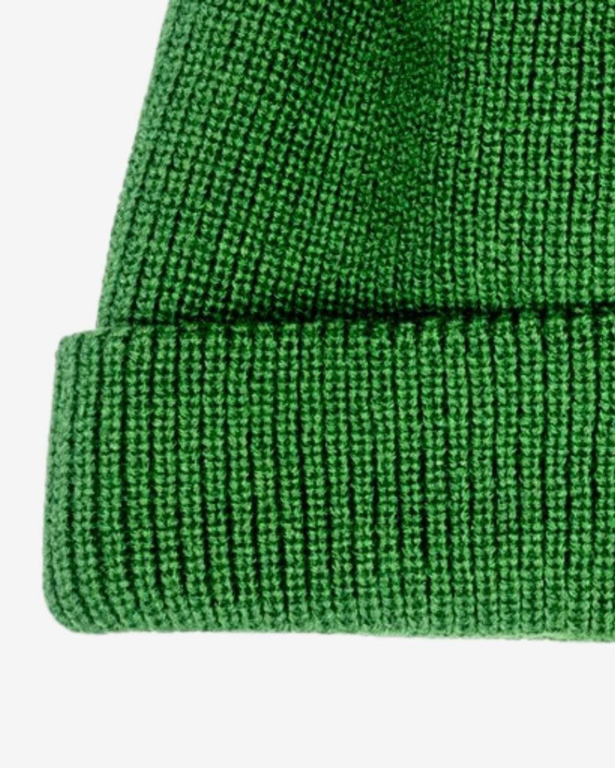 Cozy hunter green knit beanie with a turn-up cuff for kids—stylish warmth for winter adventures!