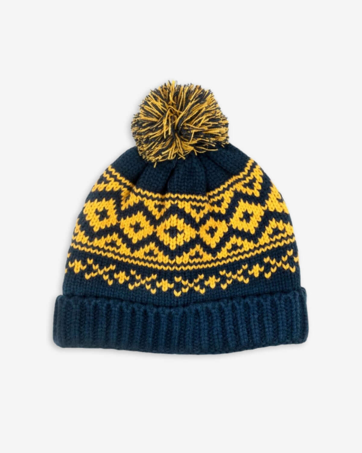 Navy blue chunky knit hat with playful pompom and vibrant yellow pattern—stylish warmth for kids this winter!