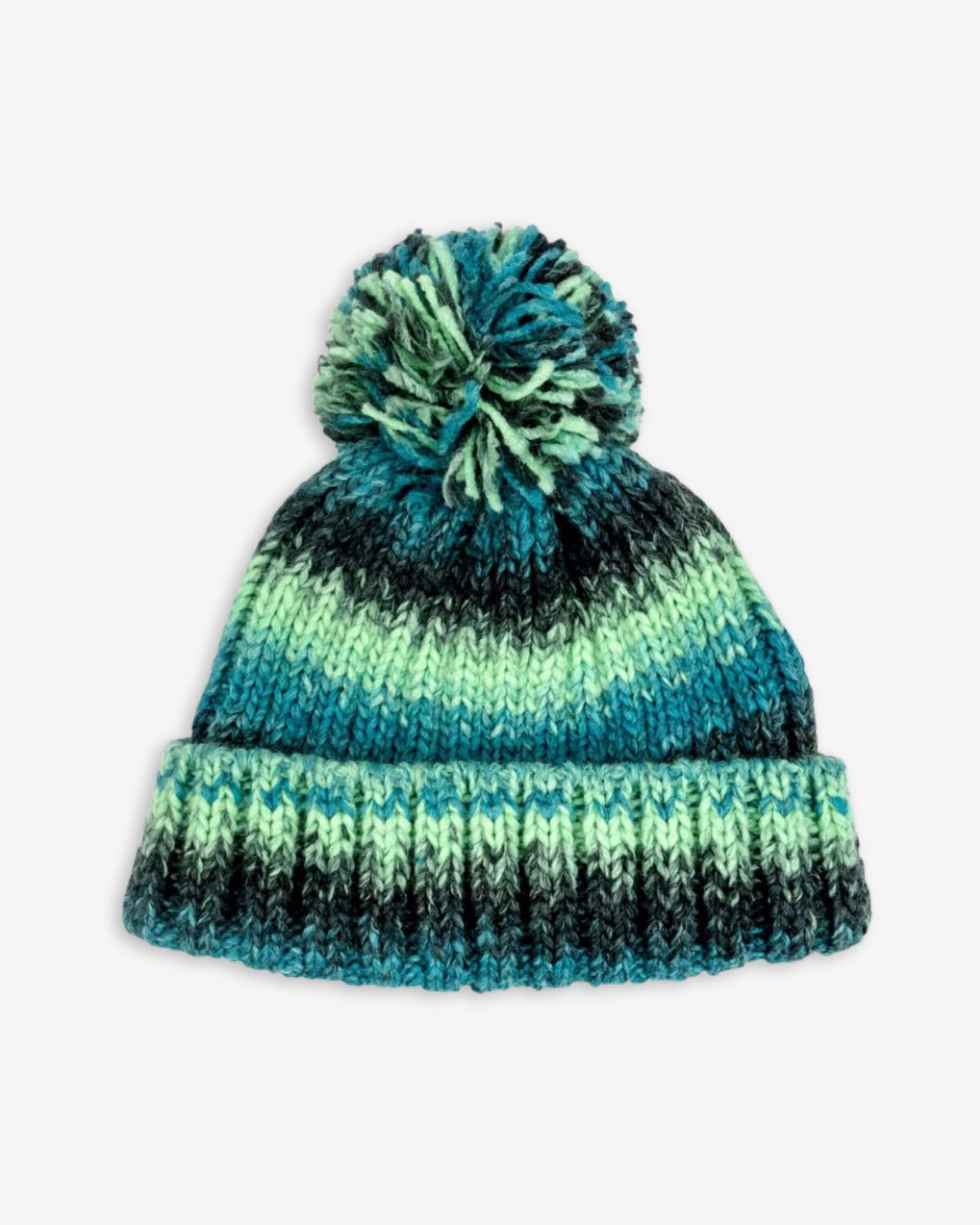 Teal alloy hat with playful pompom, keeping kids stylish and warm this winter. High-quality accessory for back to school.