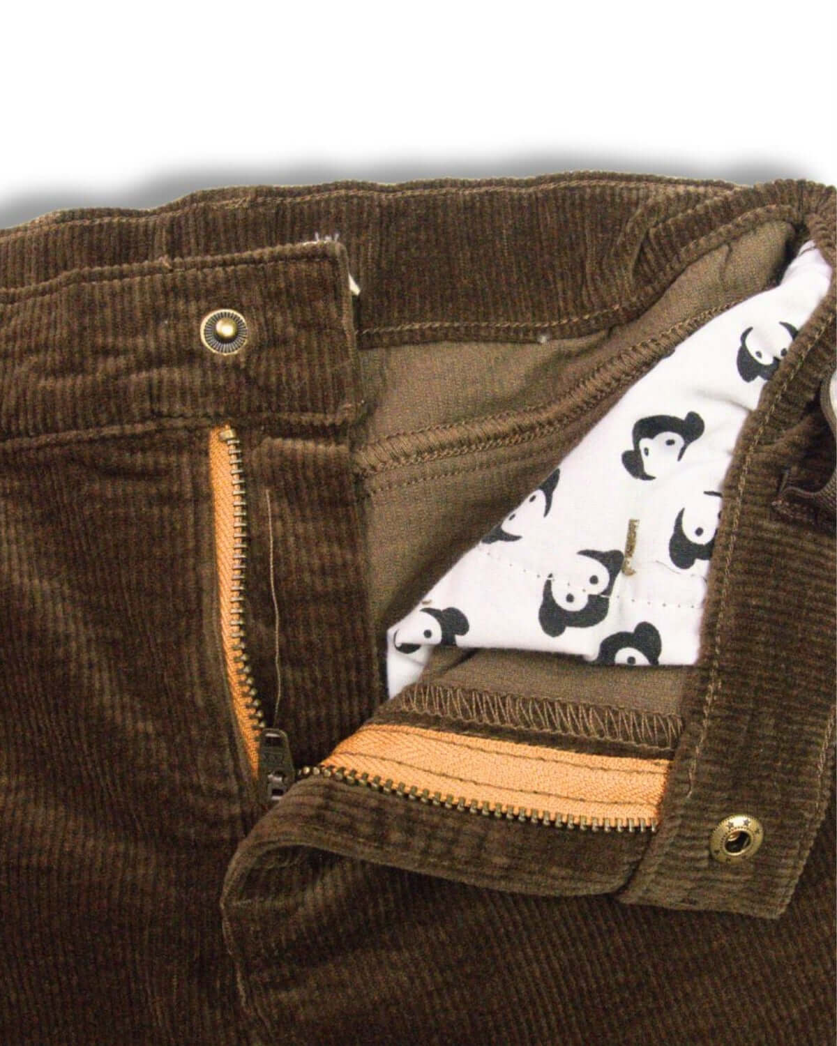 Inside view of Appaman's stylish brown skinny cords showcasing playful panda print lining—perfect for fashionable kids!