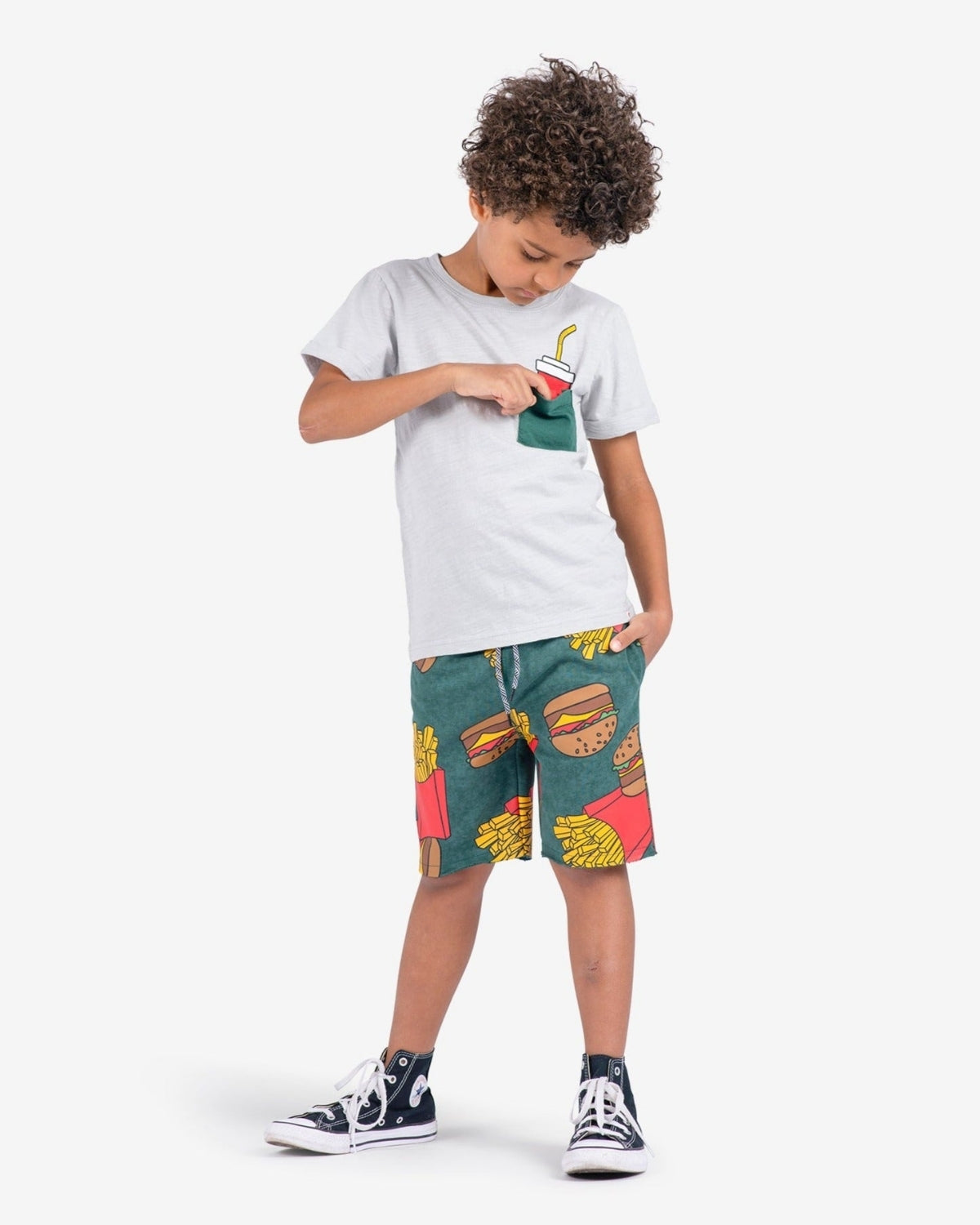 Stylish kid rocking Appaman's Burgers & Fries Camp Shorts with a fun tee—perfect for adventurous summer days!