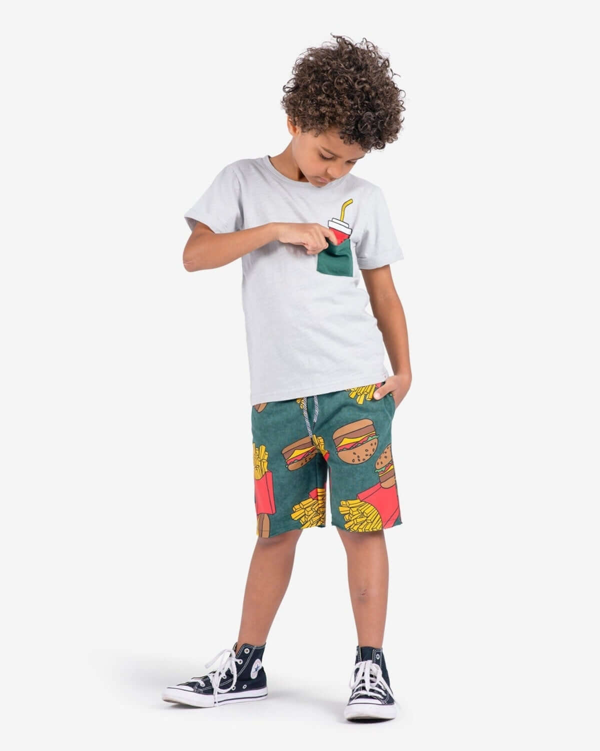 Boy wearing Burgers & Fries Camp Shorts and a grey tee with a drink pocket.