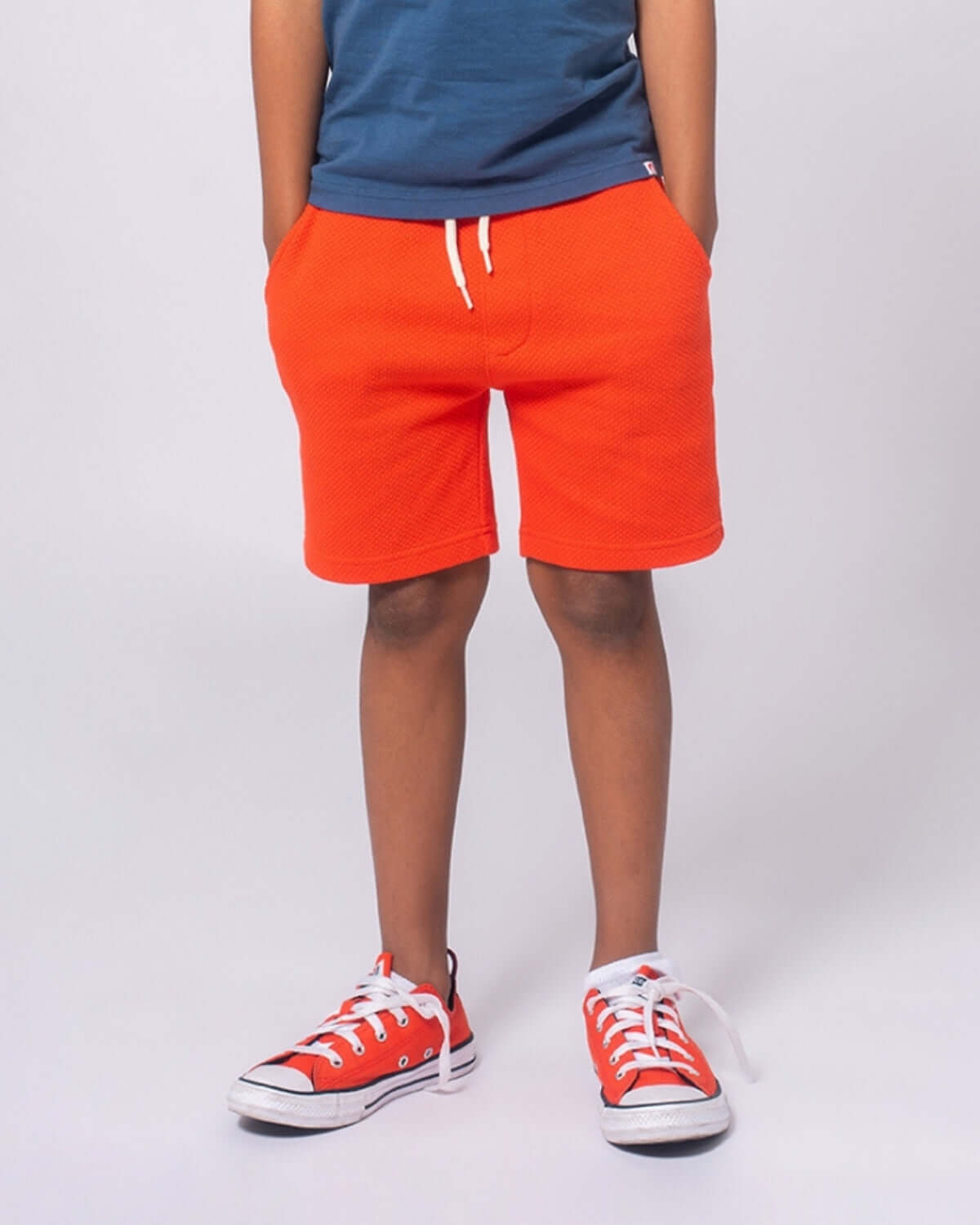 Bright orange Preston shorts for kids, perfect for playdates and adventures, with a stylish edge for back to school!