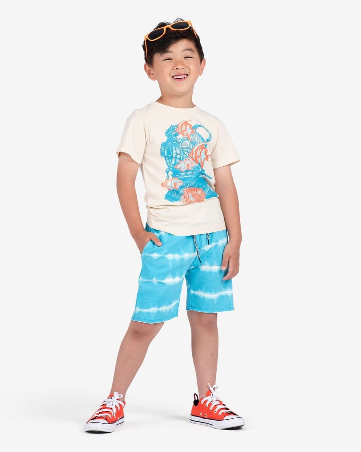 Joyful boy in bright Sea Stripe Camp Shorts, ready for summer fun in stylish and durable kids clothes.