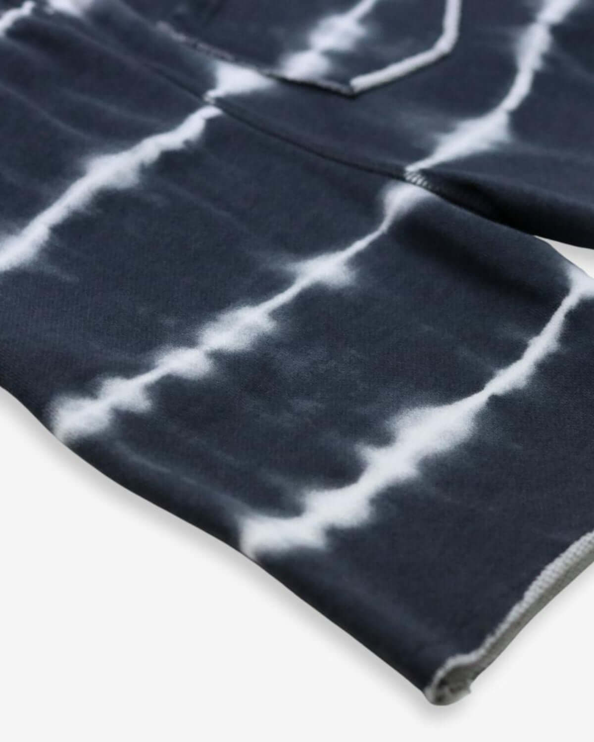 Close-up of Shadow Stripe Camp Shorts, showcasing trendy tie-dye pattern for stylish summer adventures.