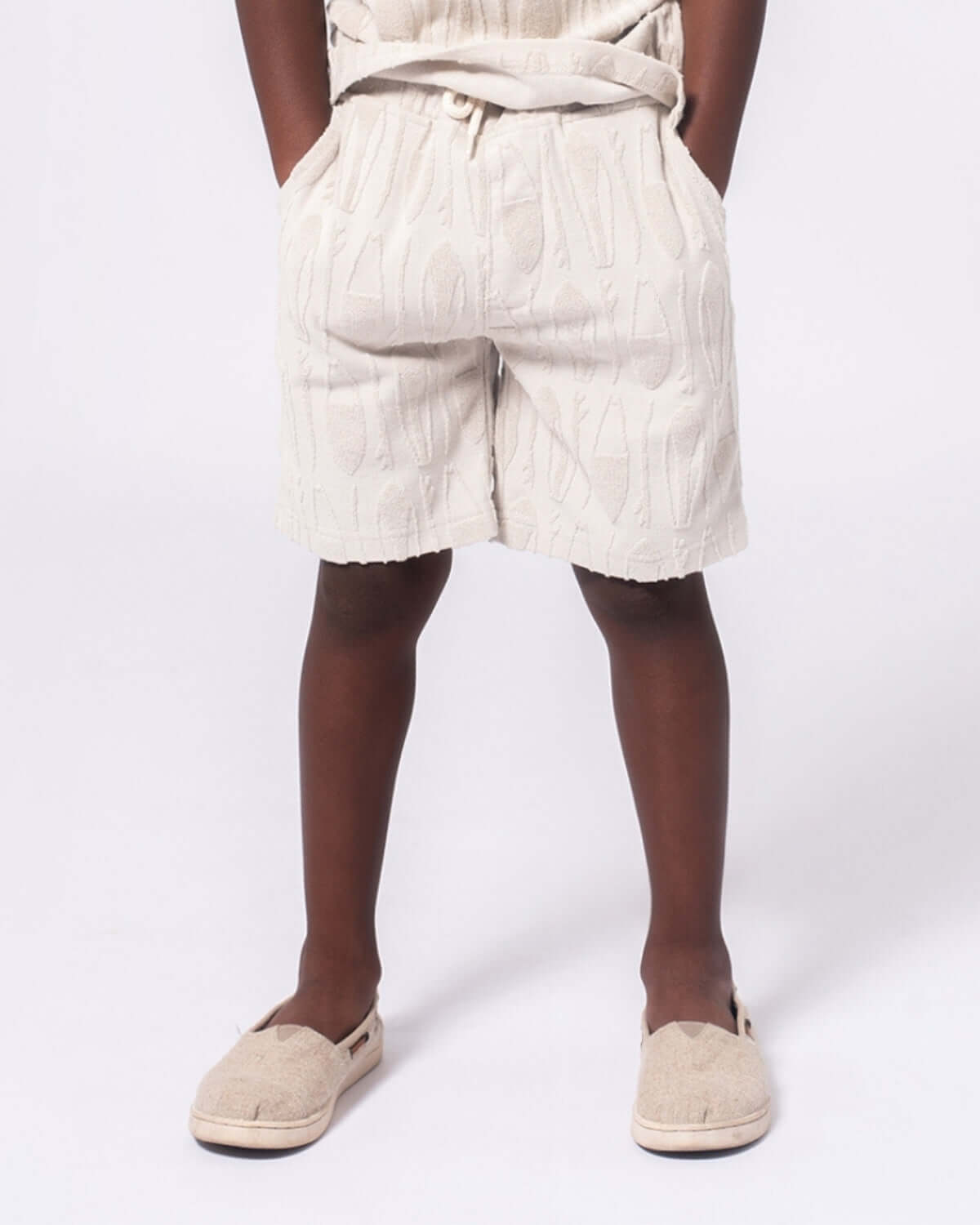 Child wearing Surfboards Preston Shorts in Taupe, perfect for beach days and casual outings.