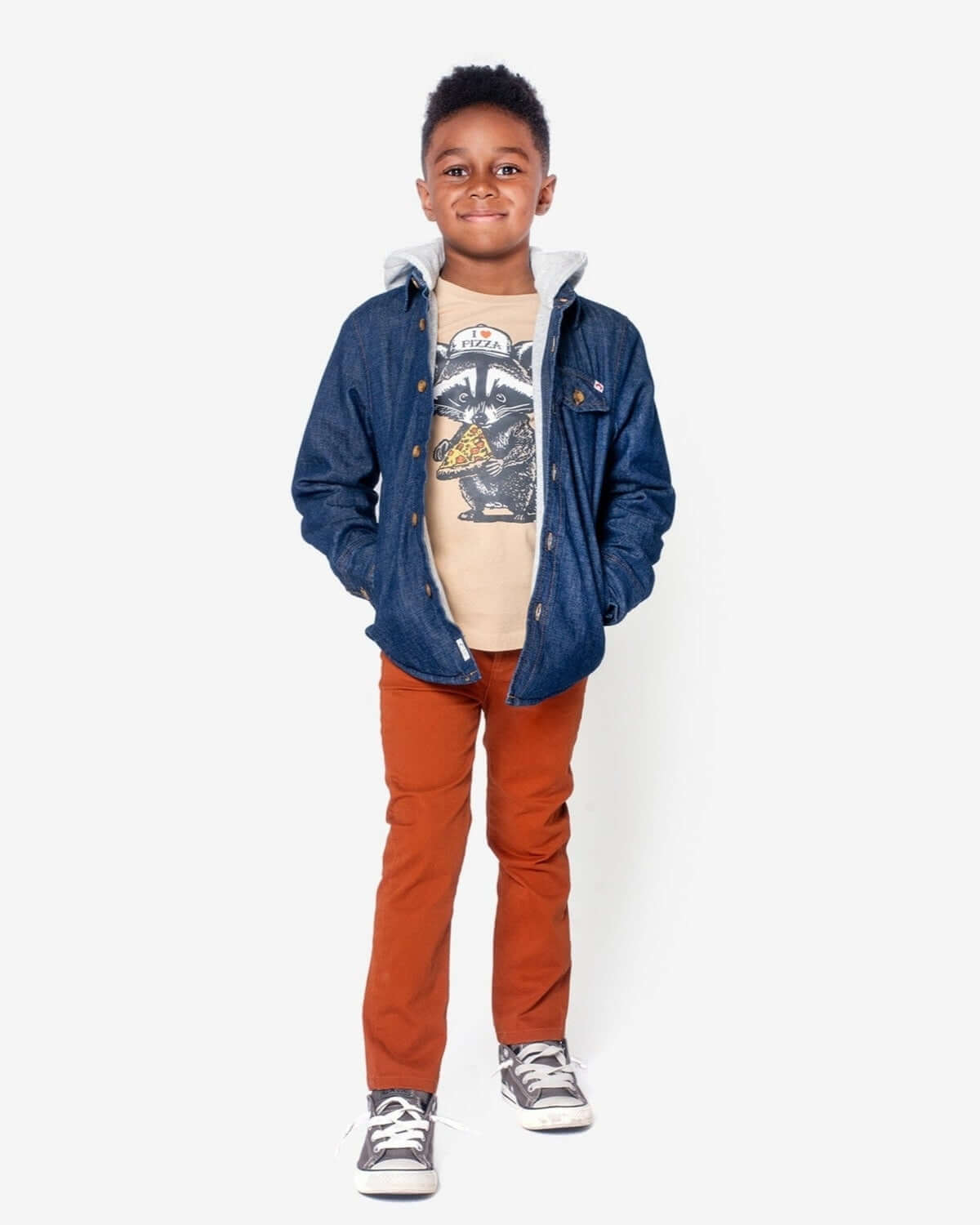 Terracotta Skinny Twill Pants styled with a denim jacket and graphic tee, perfect for a modern casual look.