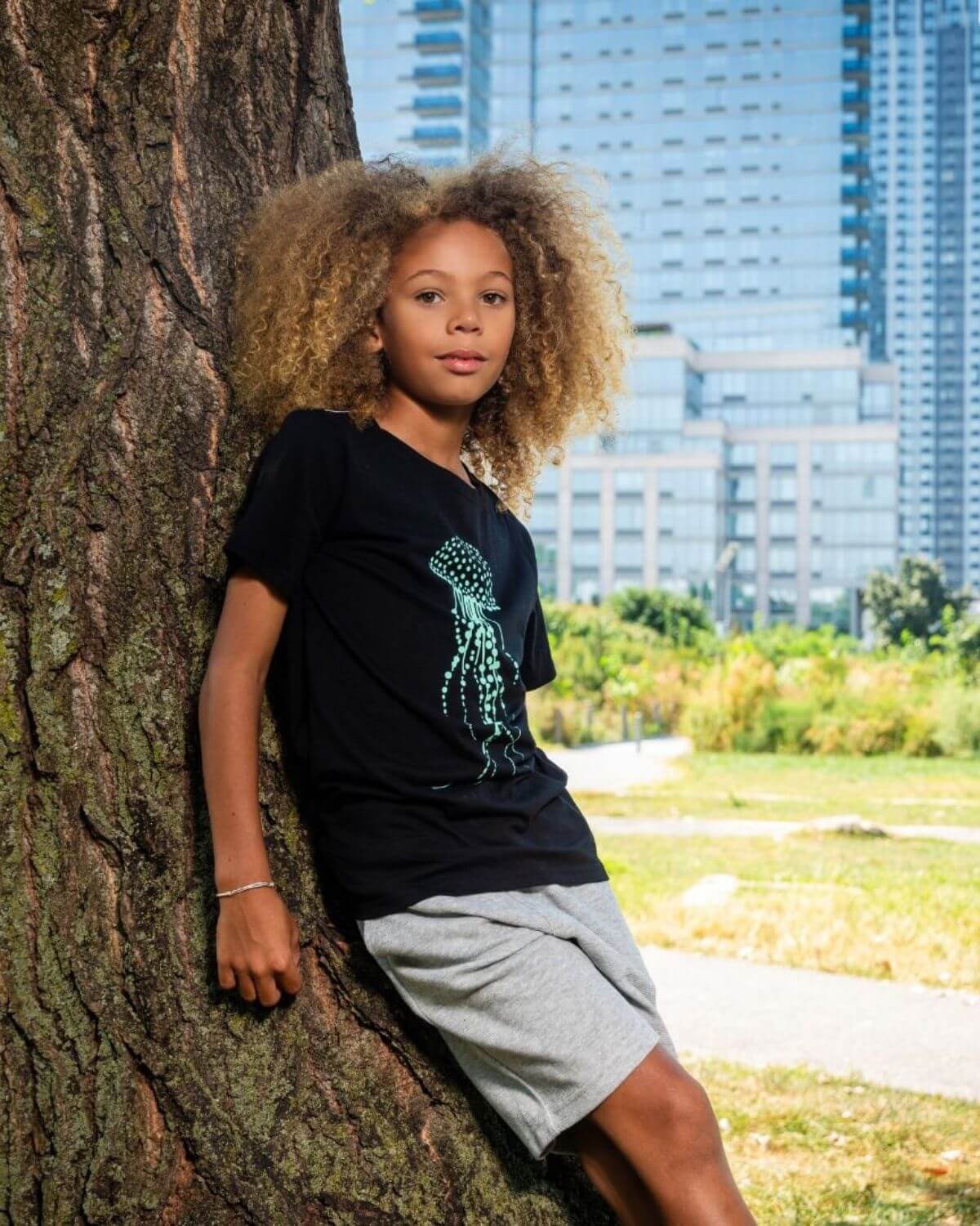 Cool jellyfish graphic tee on a kid exploring the outdoors—stylish kids clothes for fun adventures and back to school.