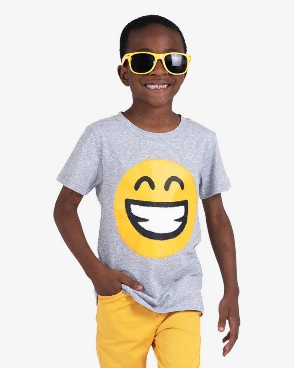 Keep Smiling Graphic Tee worn by child with yellow sunglasses and smiley face design.
