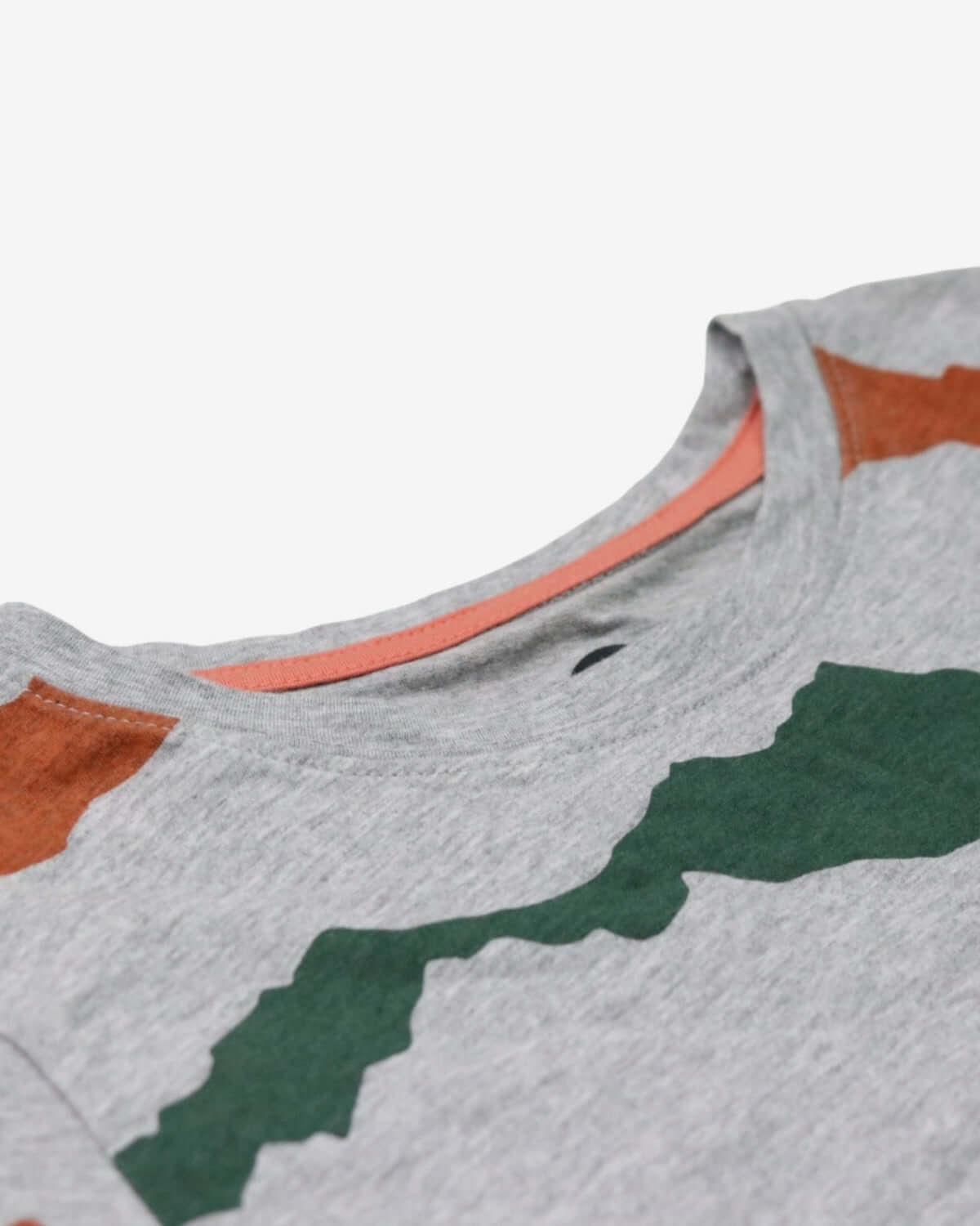 Close-up of a comfy mountain peaks graphic tee for kids, showcasing bold designs and soft fabric—ideal for outdoor adventures.