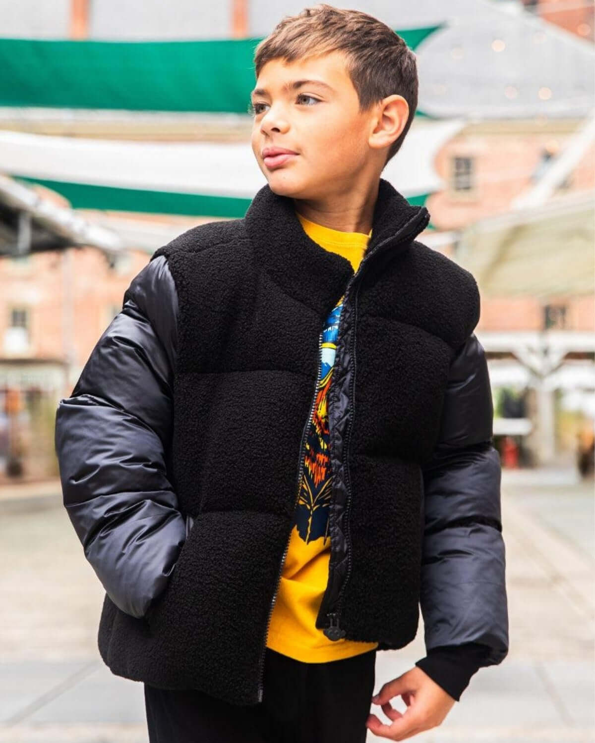 Stylish boy rocking a black teddy cropped puffer jacket, perfect for kids' cozy winter adventures and back-to-school flair!