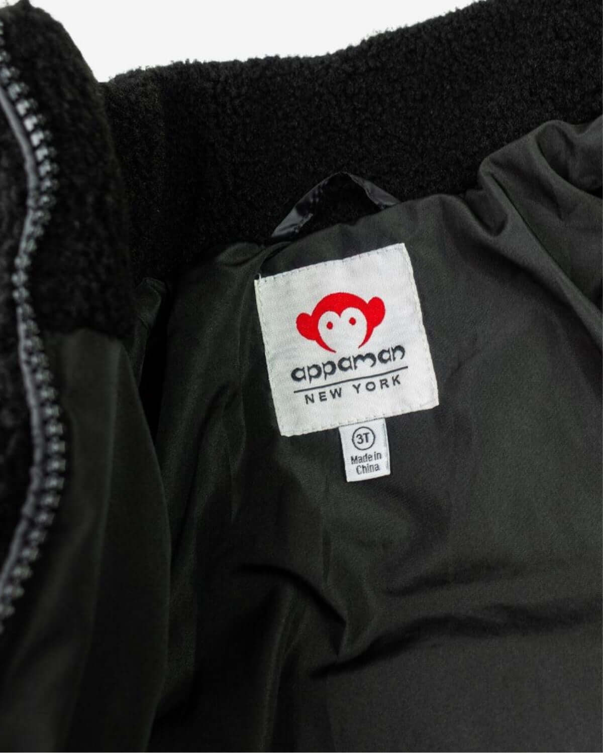 Appaman's cozy black teddy puffer tag, showcasing high-quality kids clothes made for adventure and style!