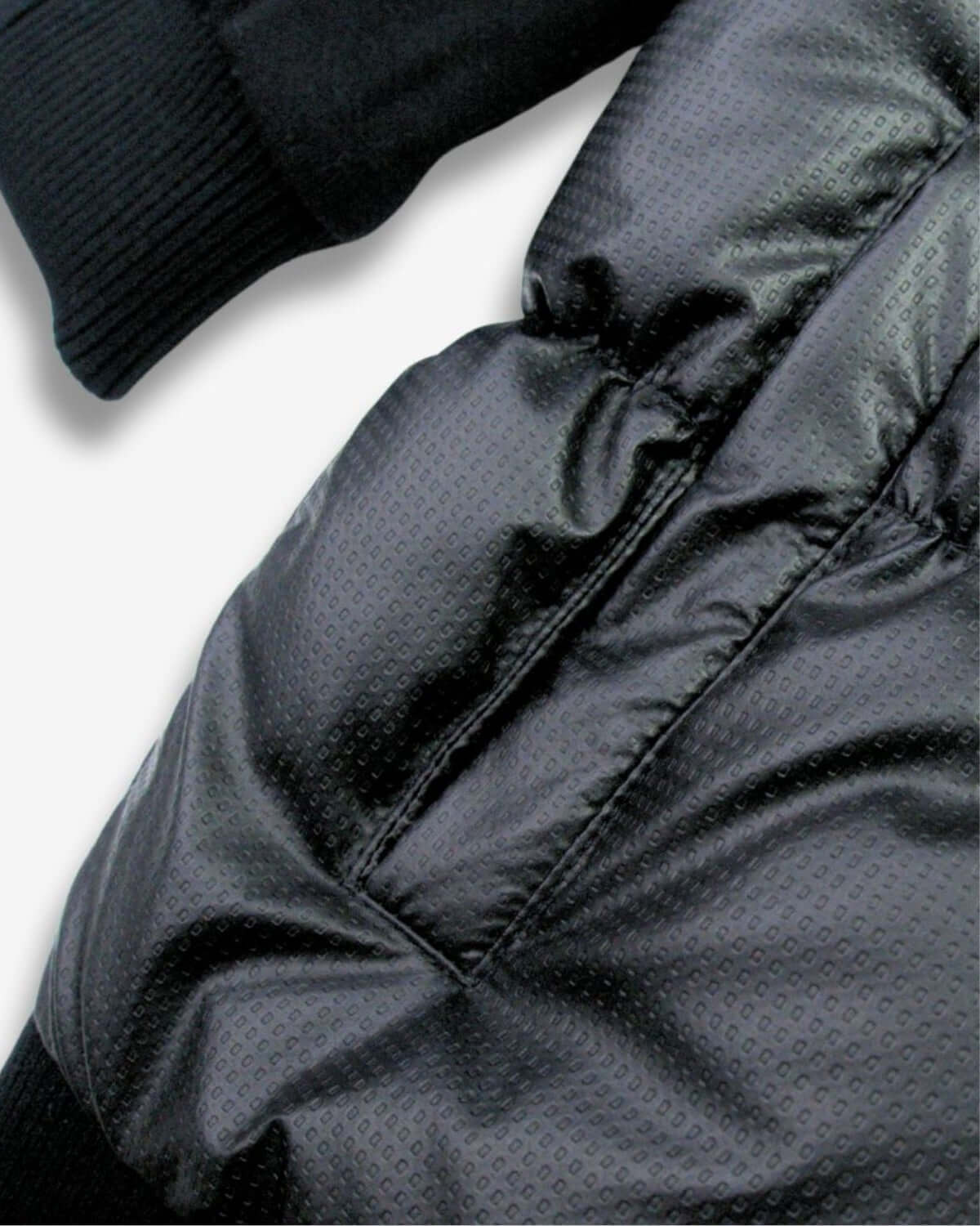Chic close-up of the Black Turnstile Jacket, blending sleek puffer style with cozy hoodie vibes for trendy kids!