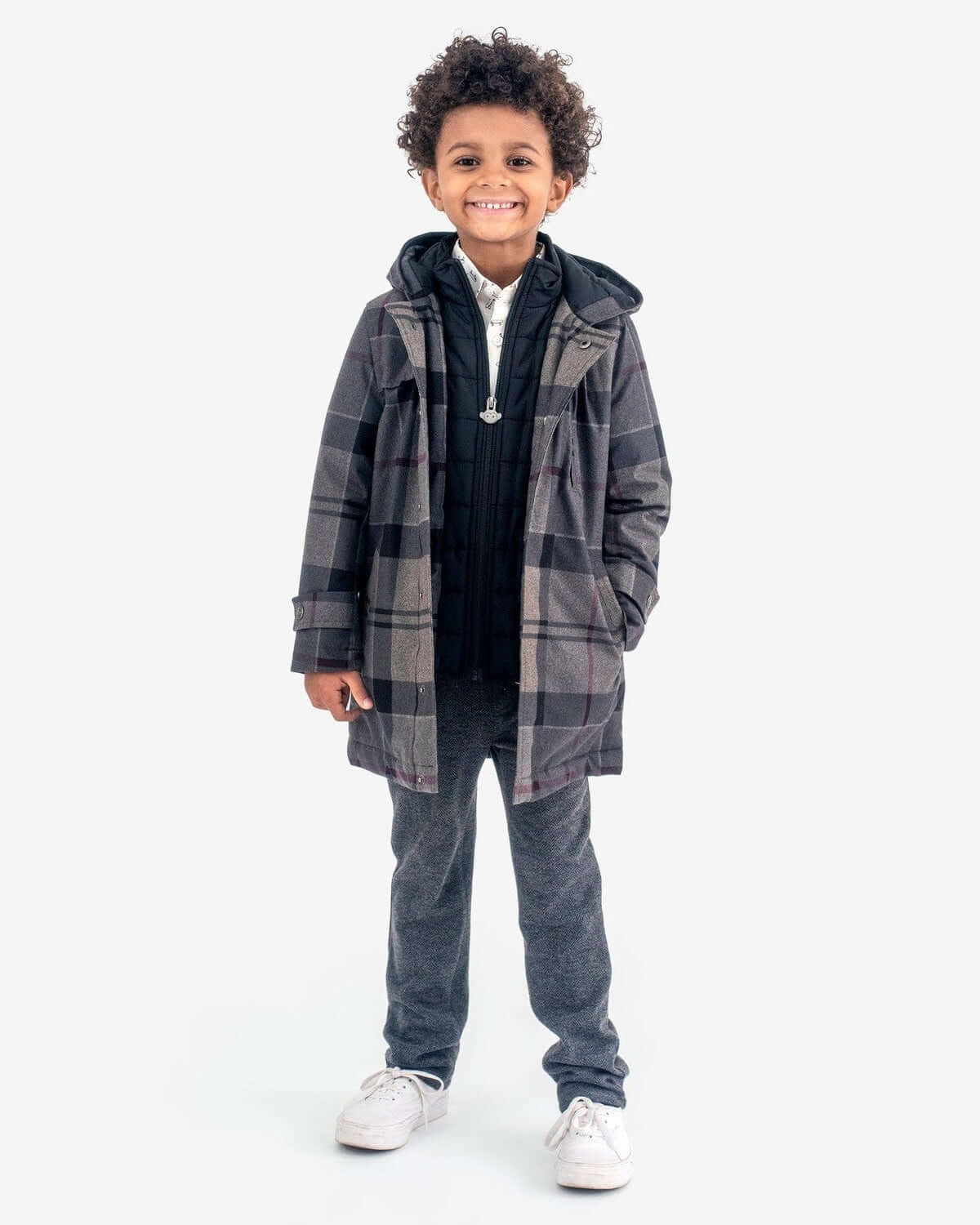 Boy wearing a Grey Plaid New Gotham Coat, smiling and ready for the city.