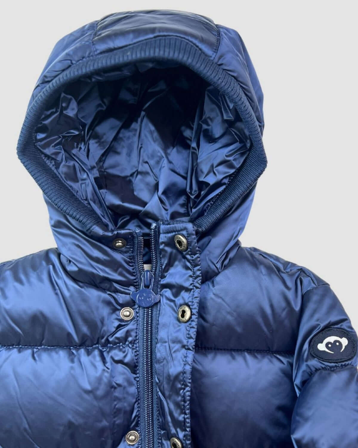 Stylish kids navy blue puffer coat with cozy hood—high-quality winter wear for playful adventures in warmth!