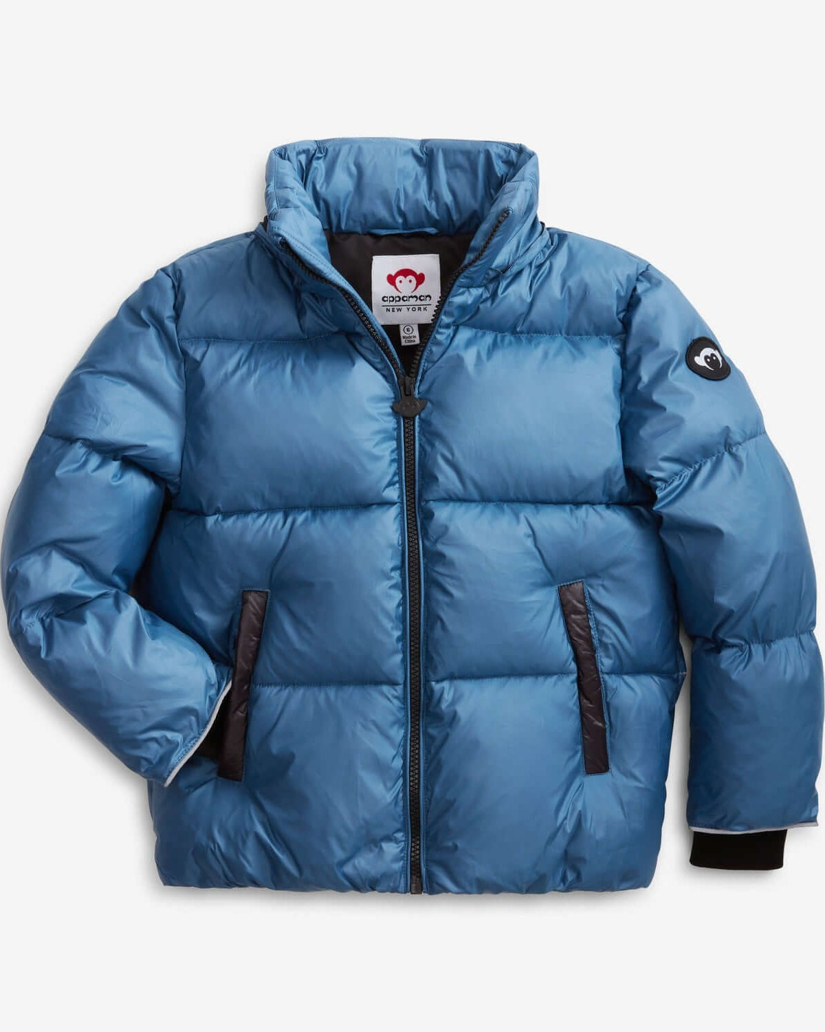 Stylish light blue mixed puffer coat for kids, blending warmth and trendy design for school or outdoor fun.