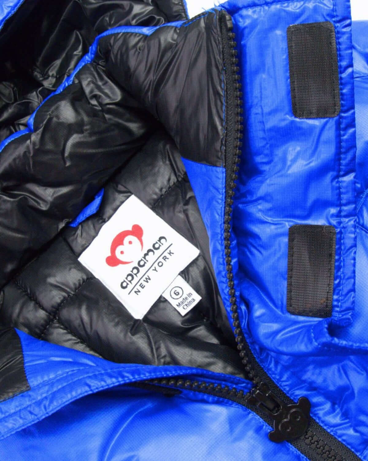 Inside view of the playful Reflex Blue Summit Puffer Coat, showcasing vibrant color and cozy insulation for stylish winter warmth.