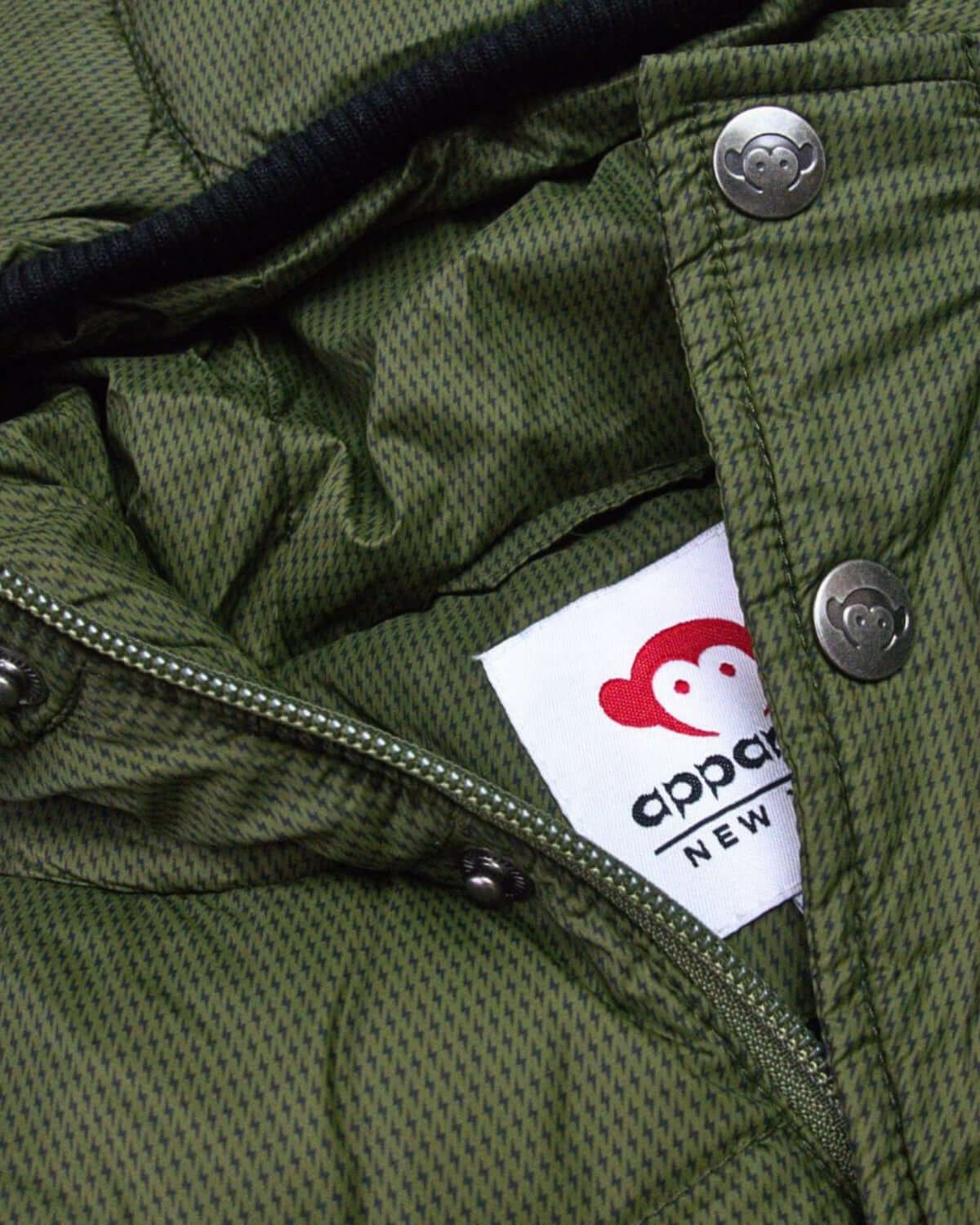 Cozy interior of the Thunderstorm Puffy Coat by Appaman, perfect for stylish kids ready for winter adventures.