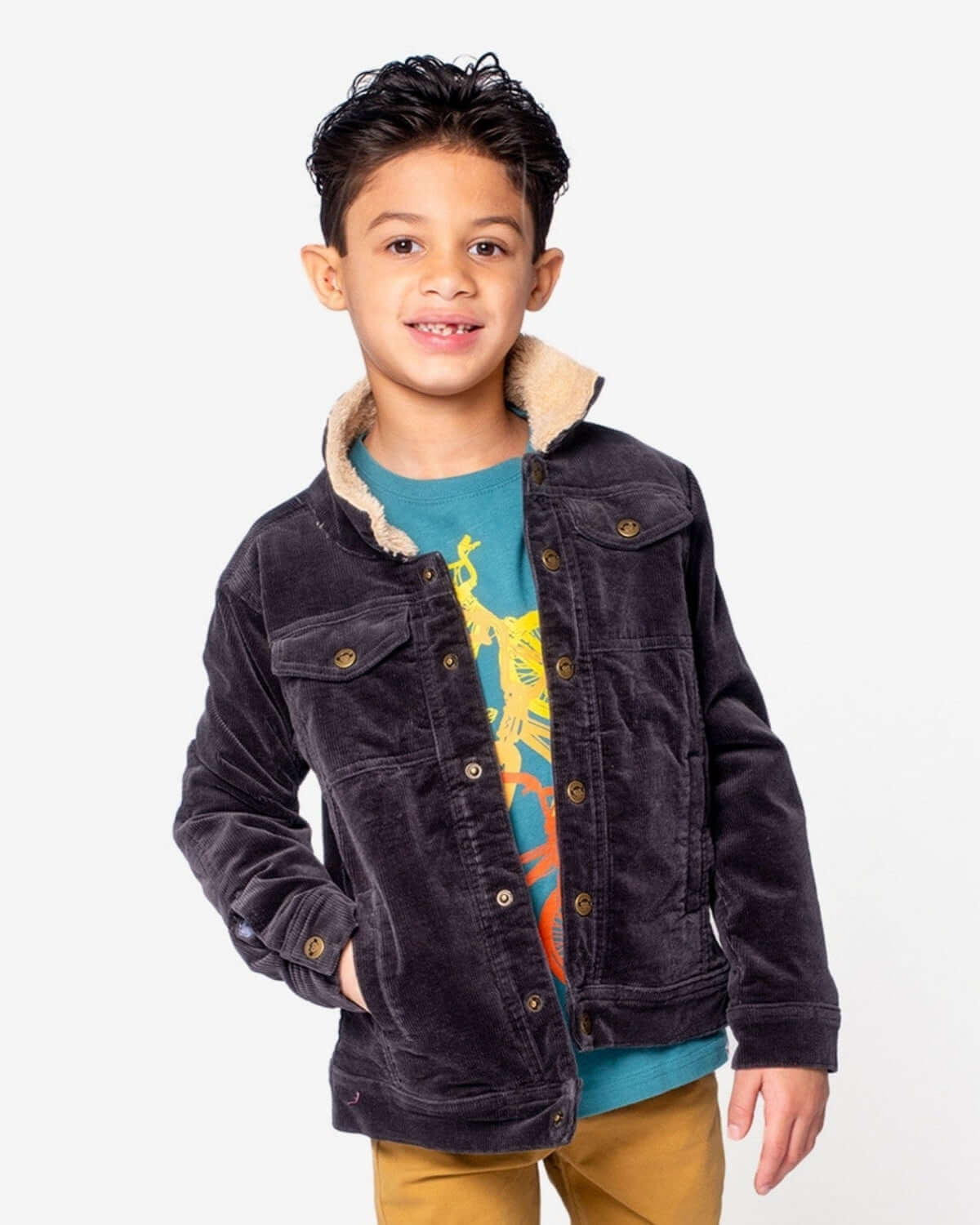 Stylish kid in a vintage black cord jacket with sherpa lining, rocking cool kids clothes for back to school.