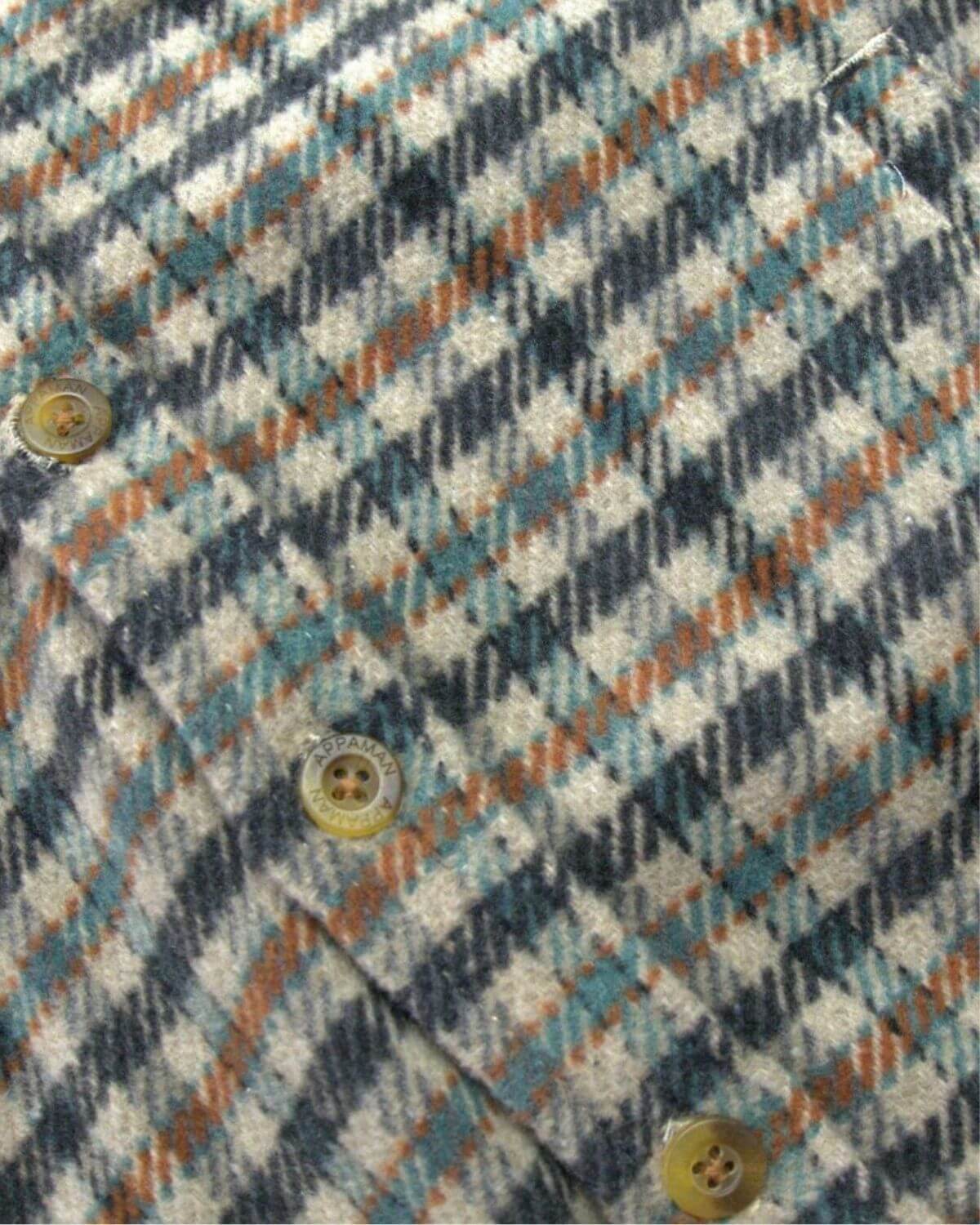 Close-up of the stylish beige/teal check pattern on the Glen hooded shirt, perfect for modern kids' fashion.