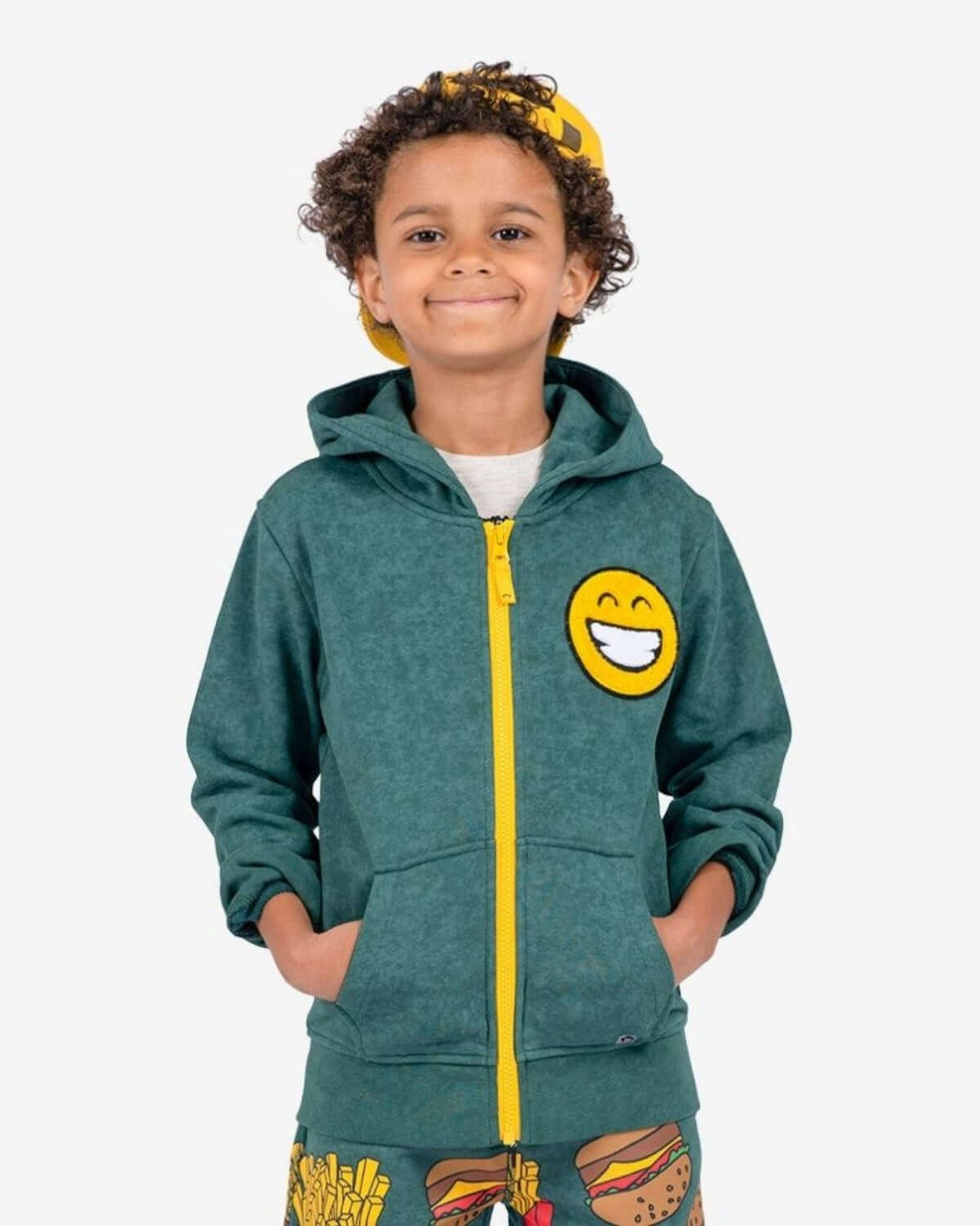 Dark Green Strivers Hoodie on a smiling child with an emoji face, showcasing the QuickFree zipper.