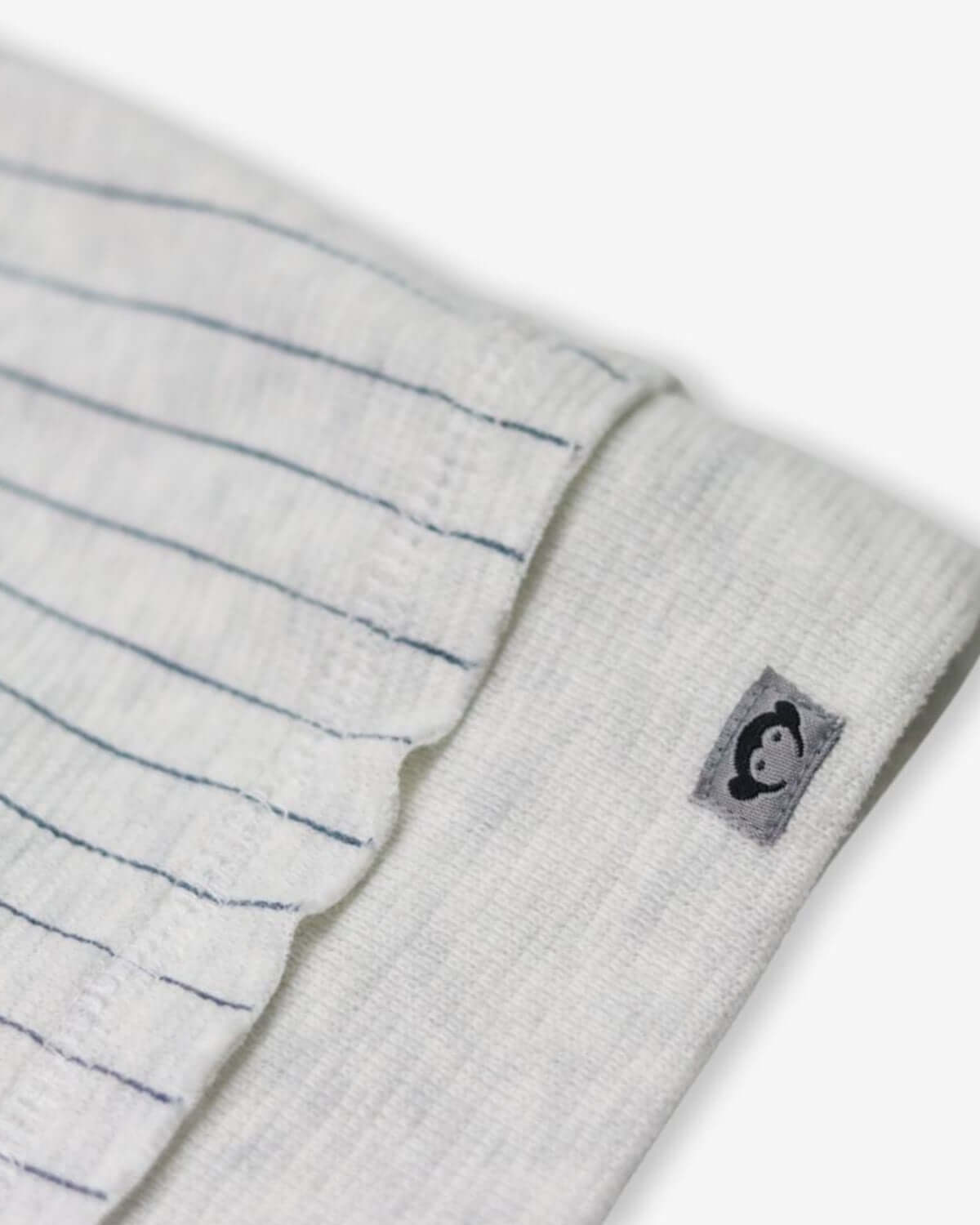 Cozy striped fabric of Happy Surfing Highland Sweatshirt, featuring a fun palm tree logo for stylish kids' adventures.