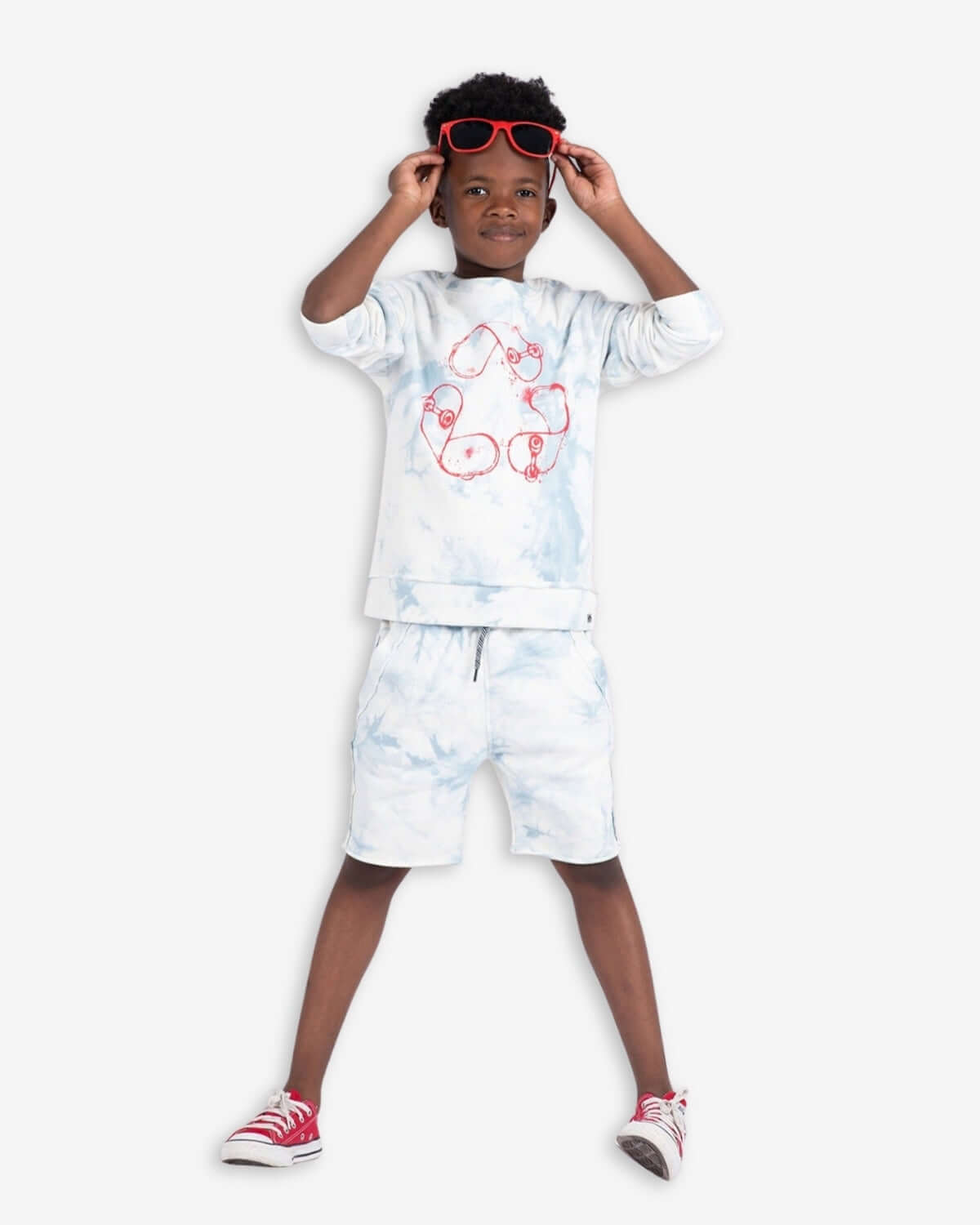 Sky Tie Dye Highland Sweatshirt paired with matching shorts, stylish boy wearing red sunglasses and summer sneakers.