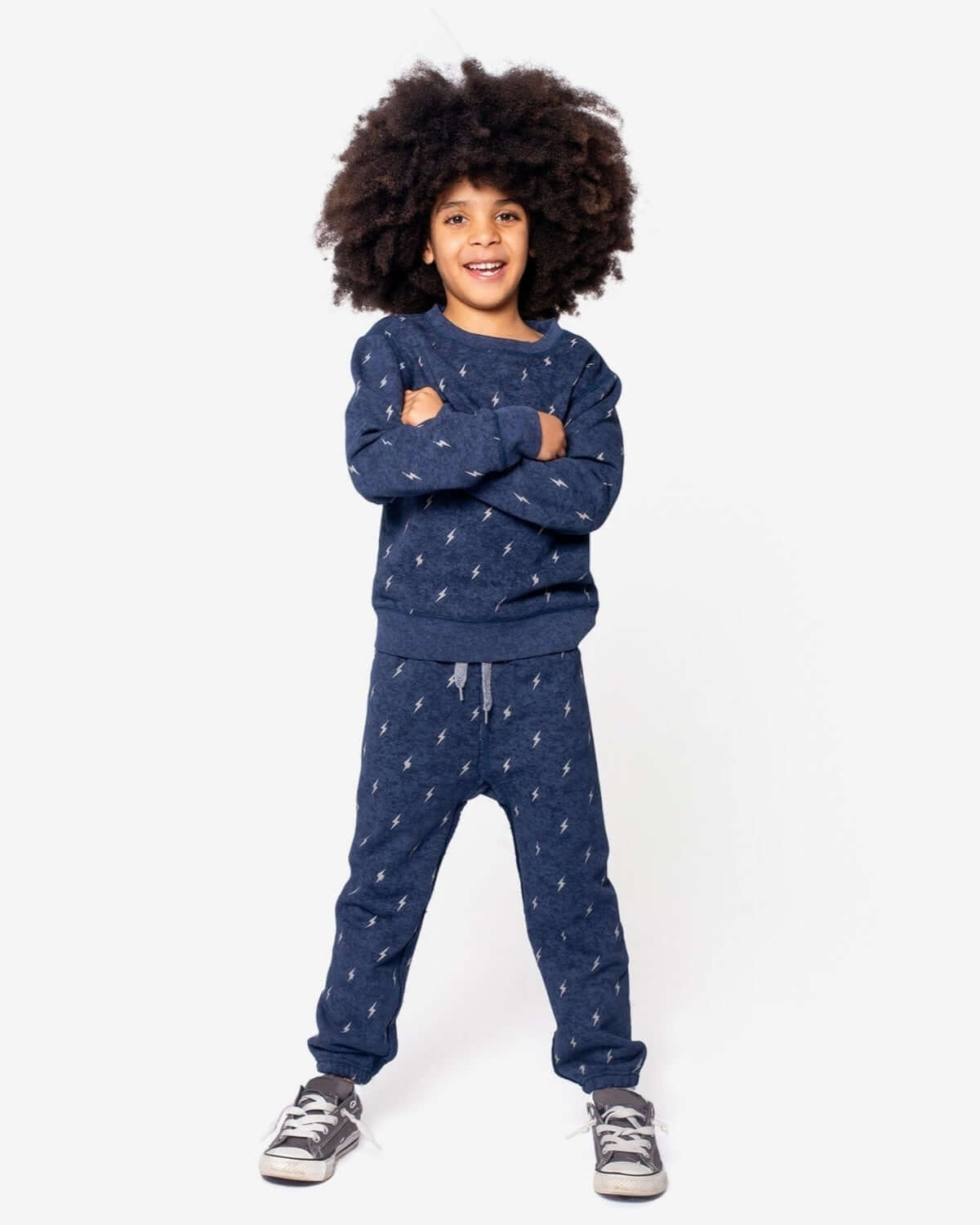 Stylish kid in Appaman's Thunderstorm Revel Crewneck and Gym Sweatpants, perfect for back to school adventures!