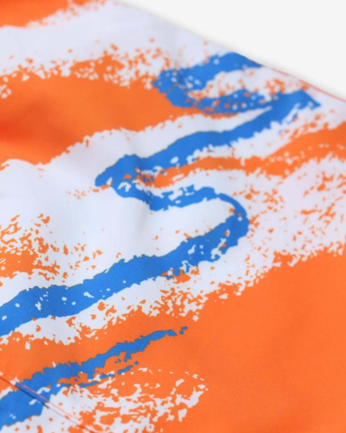 Vibrant blue and orange wave pattern on Appaman’s 90s Retro Swim Trunks, a fun addition to kids' back to school swimwear!