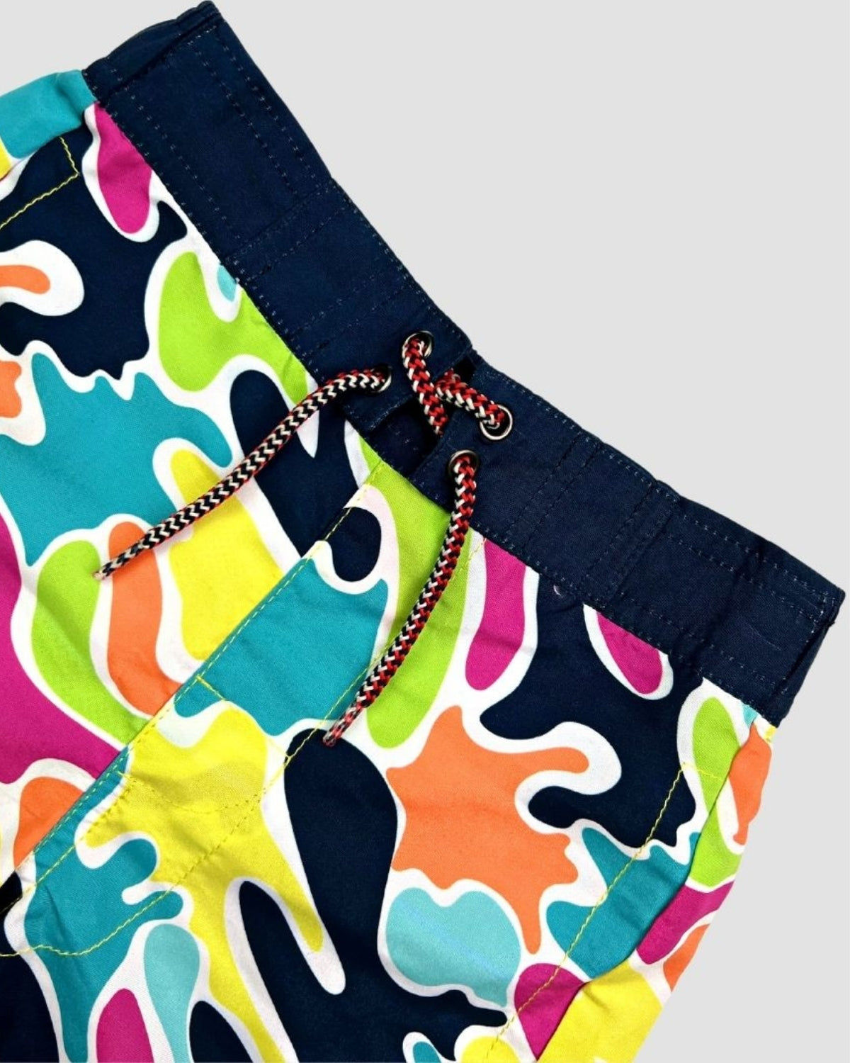 Bright and bold Color Spill Swim Trunks, perfect for stylish beach days and pool fun—made for durable adventures!