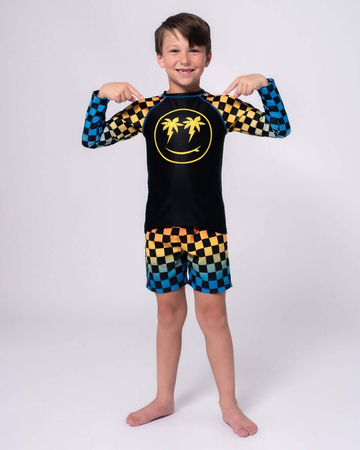 Happy Surfing Rash Guard featuring checkerboard patterns, perfect for kids' beach and water play.