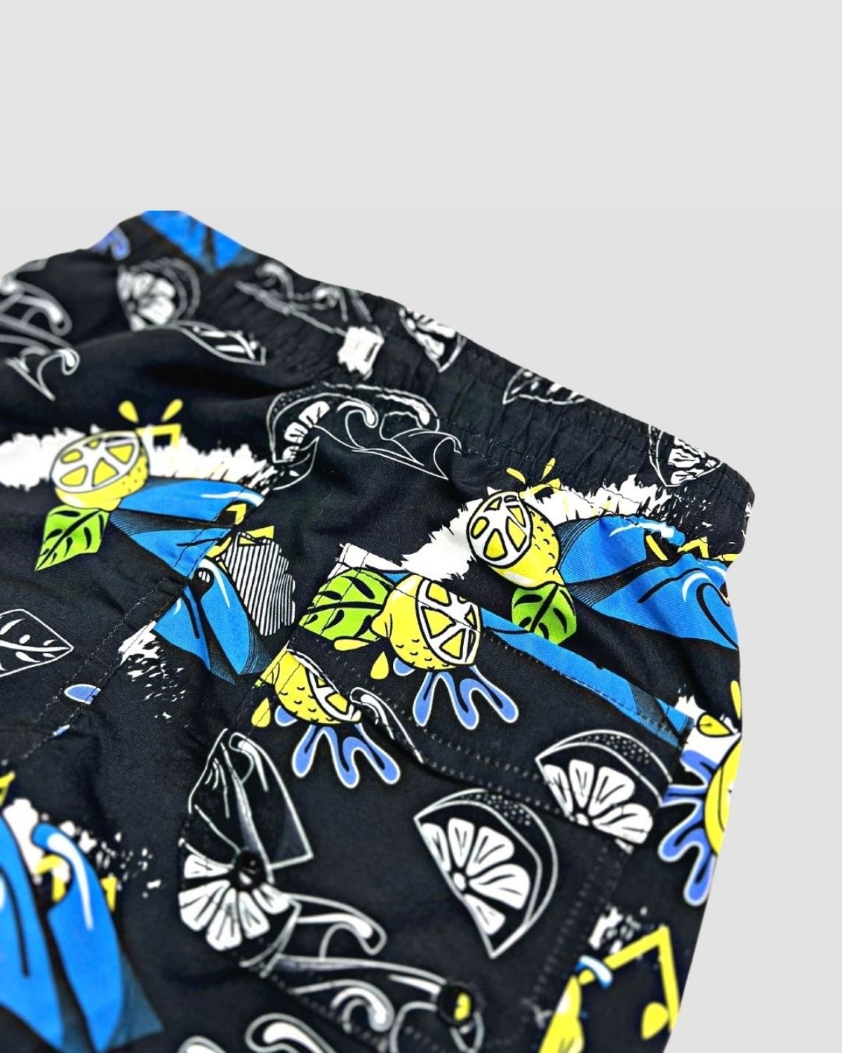 Cool lemon print on kids' swim trunks—perfect for summer fun and back-to-school adventures in style!