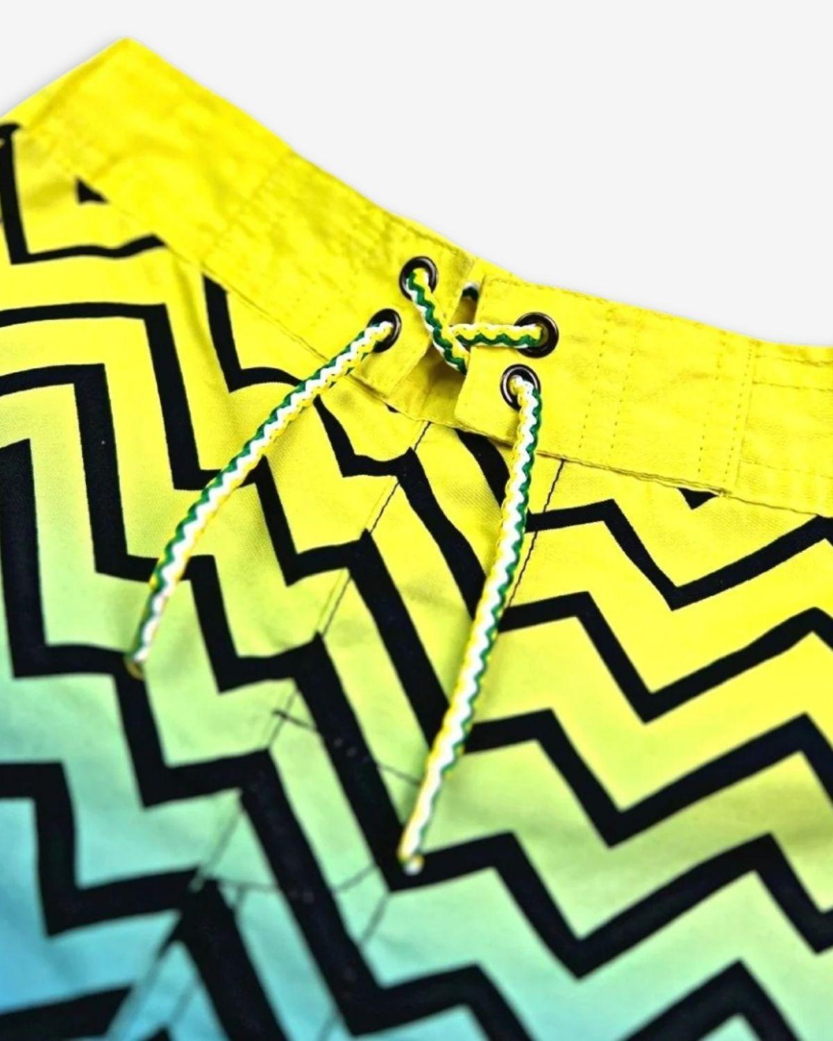 Bright zigzag swim trunks with durable UPF 50+ fabric—perfect for spirited beach days and fun poolside moments!