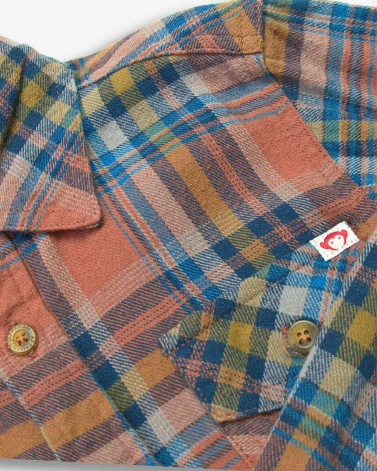 Cozy clay jewel plaid flannel shirt for kids, blending style and warmth for fall festivities.