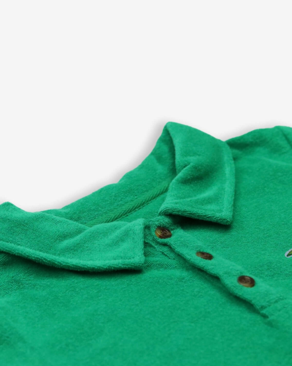 Close-up of Kelly Green Fairbanks Terry Polo showcasing the soft fabric and button details.