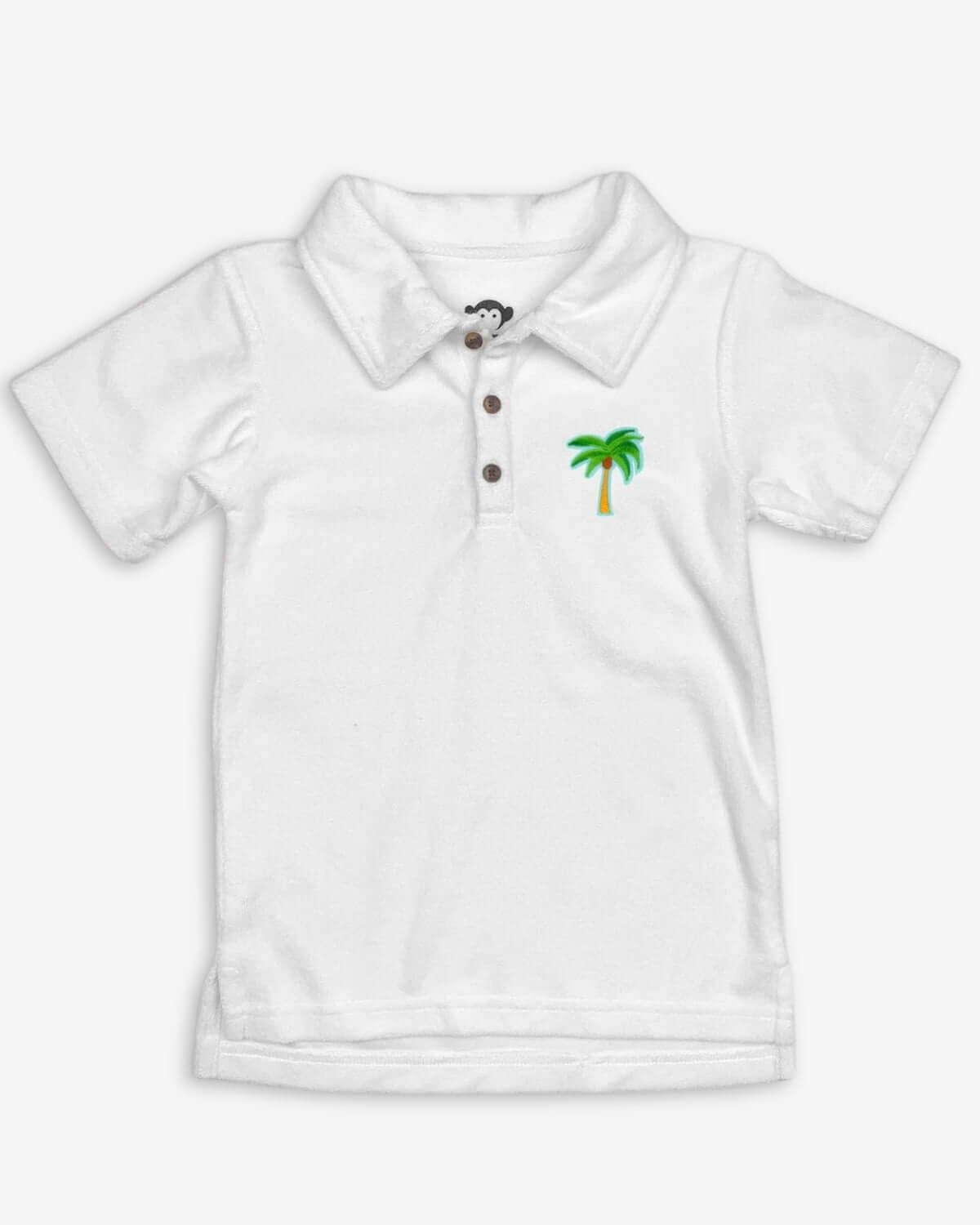 Charming white Fairbanks Polo for kids, featuring a playful palm tree design—ideal for stylish back-to-school looks!