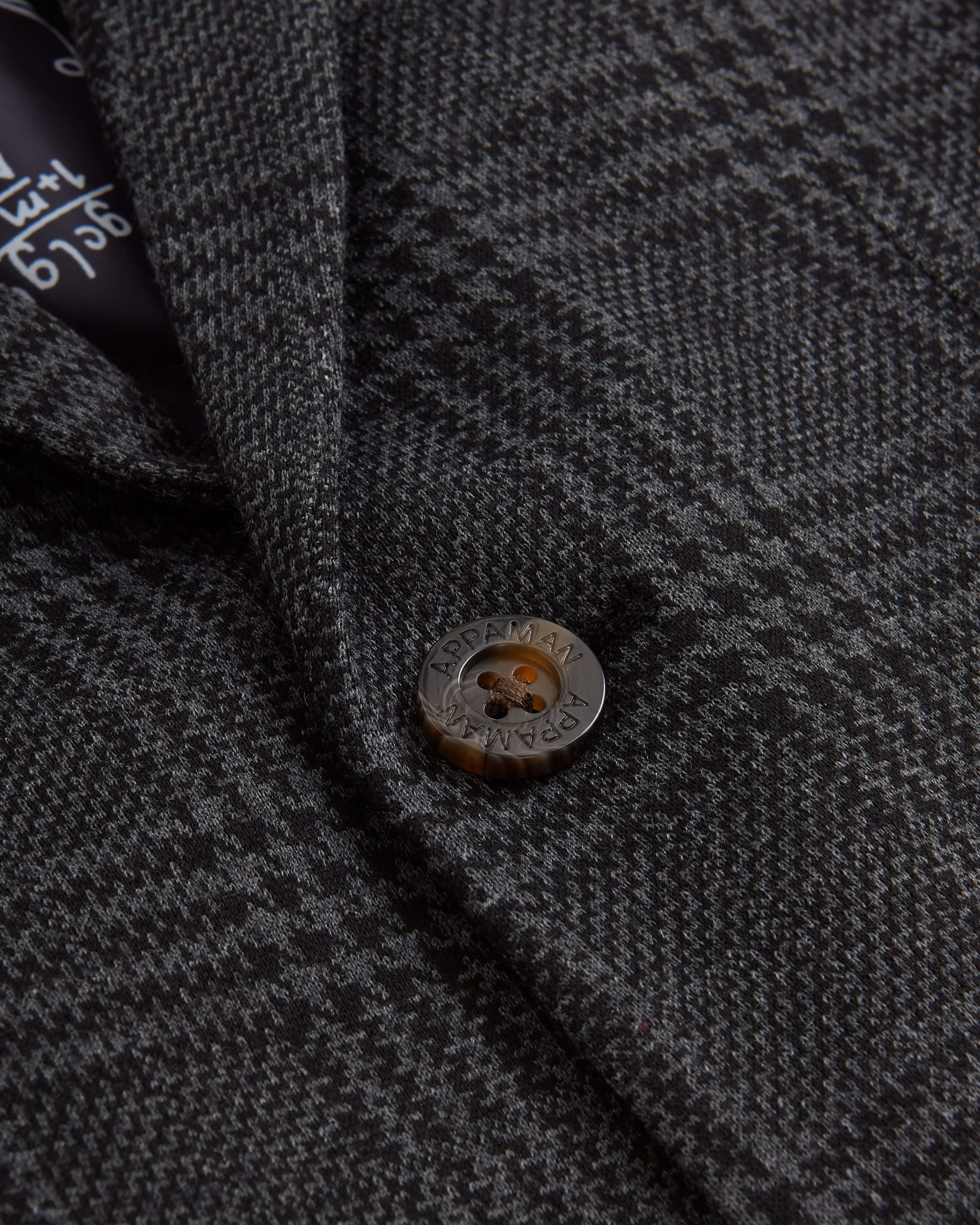 Close-up of a stylish button on the Professor Plaid Club Jacket, featuring chic detailing for trendy kids' fashion.