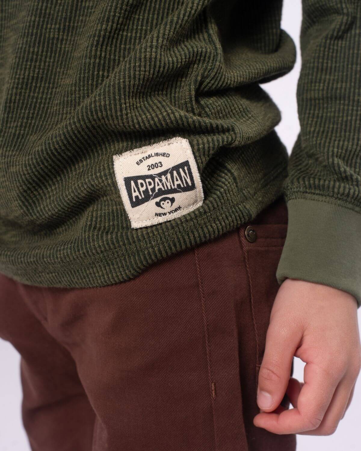 Stylish kid in dark olive Craftsman Thermal Henley with Appaman label, showcasing modern kids clothes for back to school.