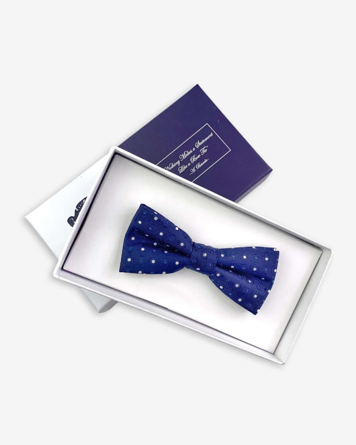 Stylish blue polka dot bow tie in a gift box—ideal addition to kids clothes for a splash of color this back to school!