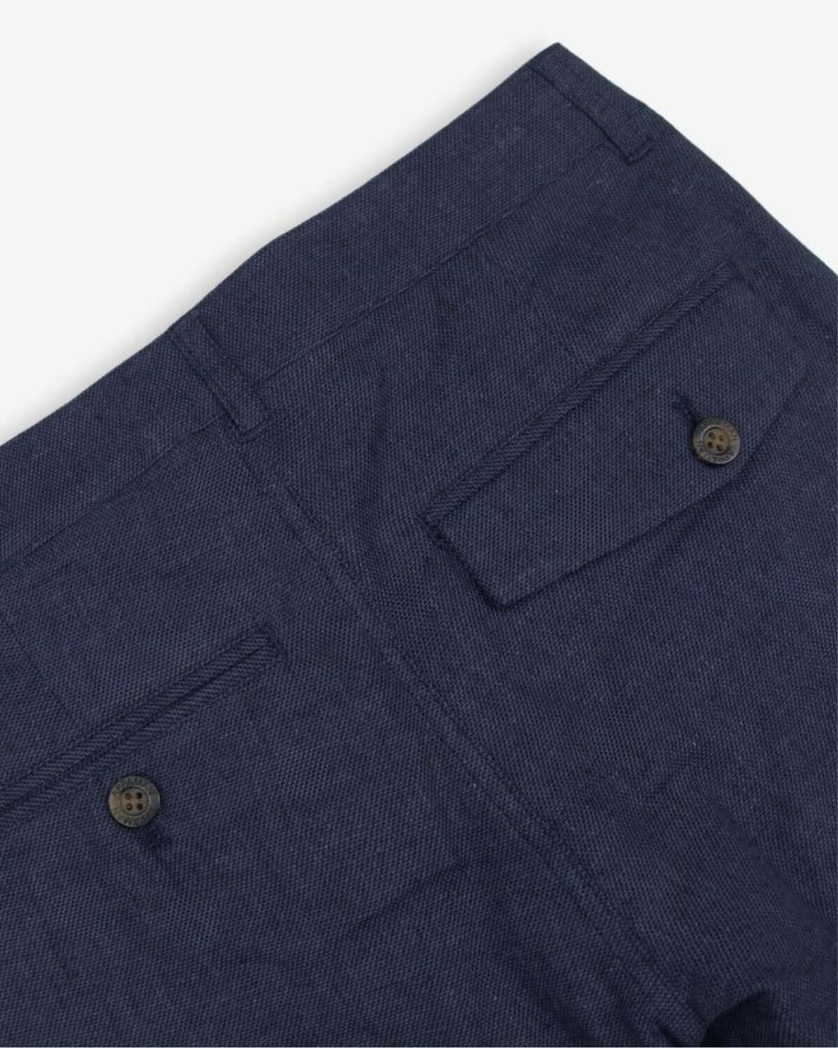Detail view of Blue Nights Linen Beach Pants showcasing back pockets and button closure.