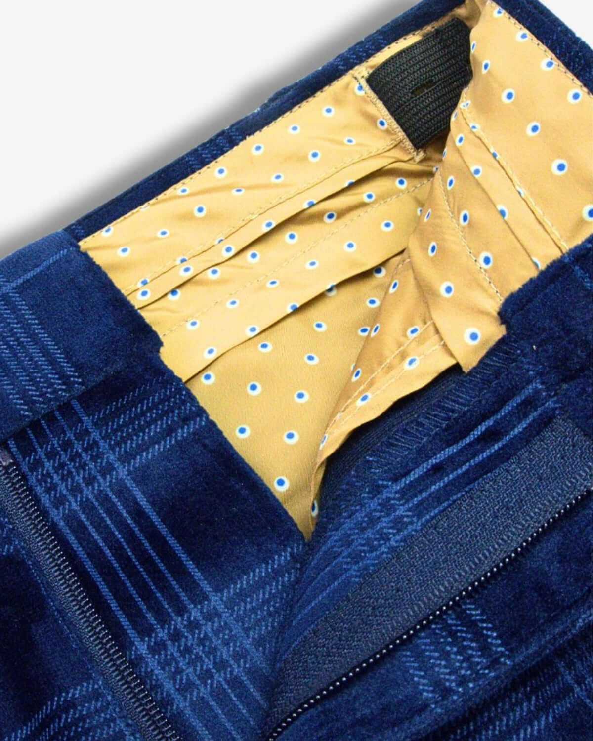 Stylish blue velvet suit pants with a fun yellow polka dot lining—perfect for kids’ back to school fashion!