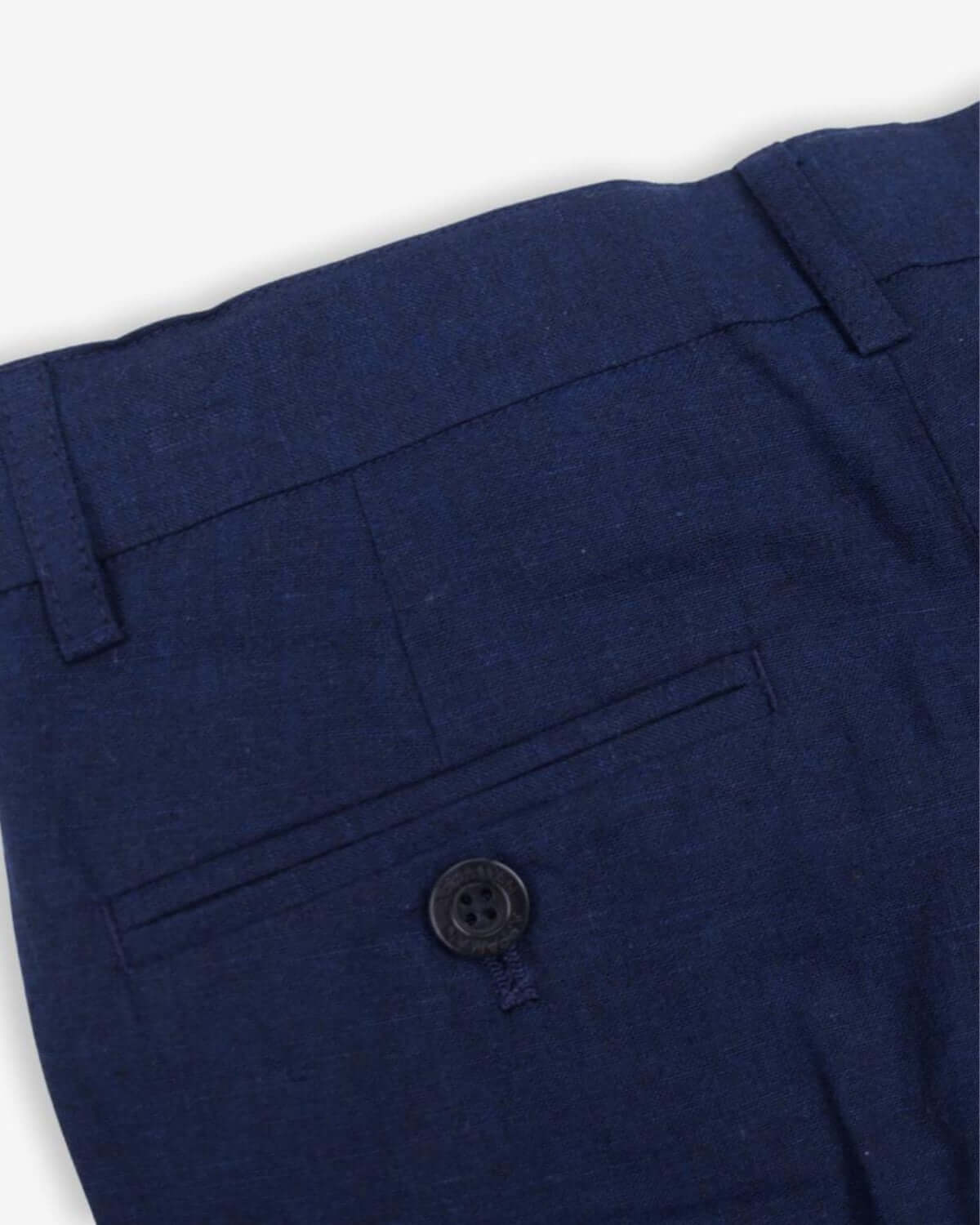 Close-up of Estate Blue Linen Stretchy Suit Pant showcasing button detail and sleek stitching for stylish kids clothes.