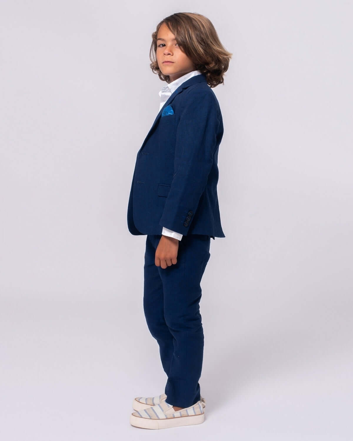 Chic kid in estate blue suit pants and matching jacket—ready to dazzle at weddings or family dinners! Stylish and comfy kids clothes.