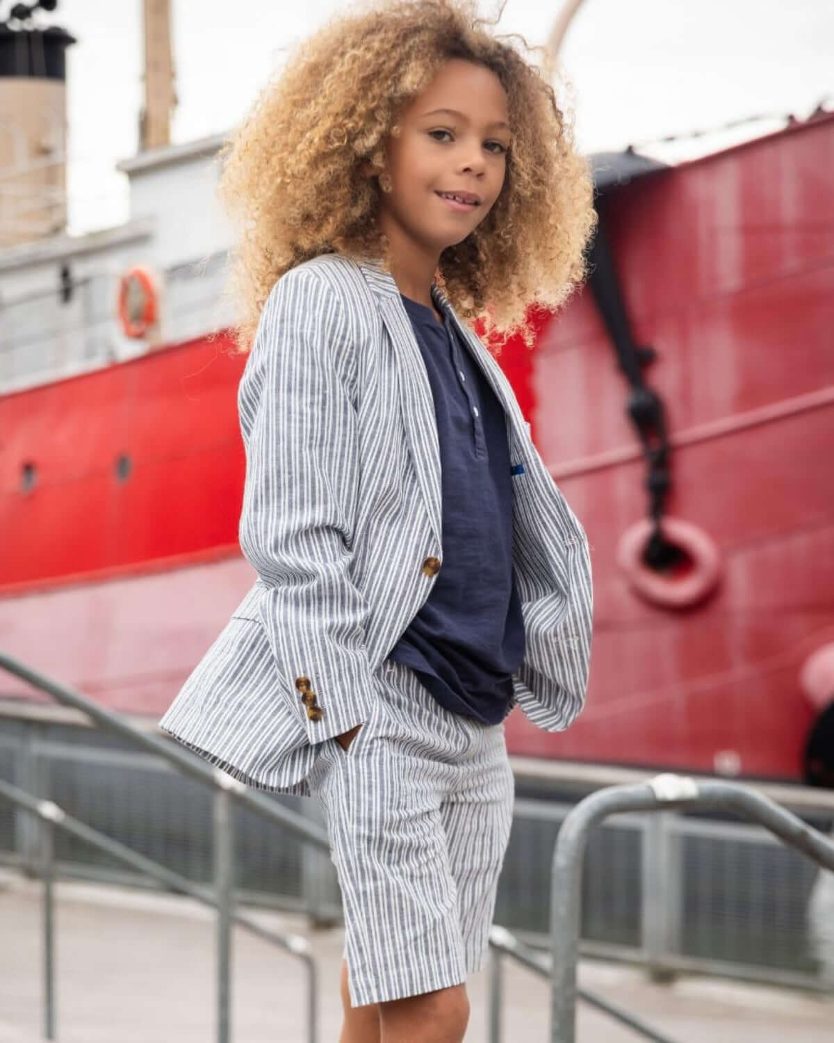 Stylish kid rocking a navy stripe linen shorts suit—perfect for summer adventures and classy outings!