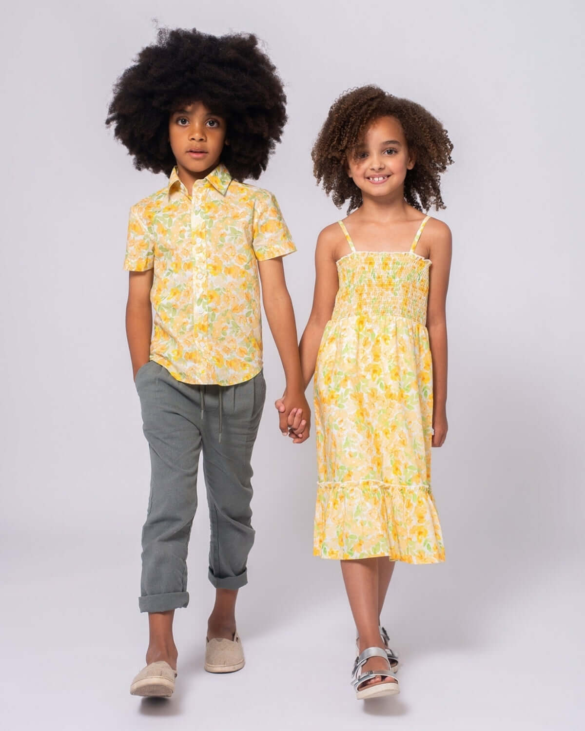Stylish kids in vibrant yellow outfits—playful summer vibes with high-quality kids clothes for boys and girls.