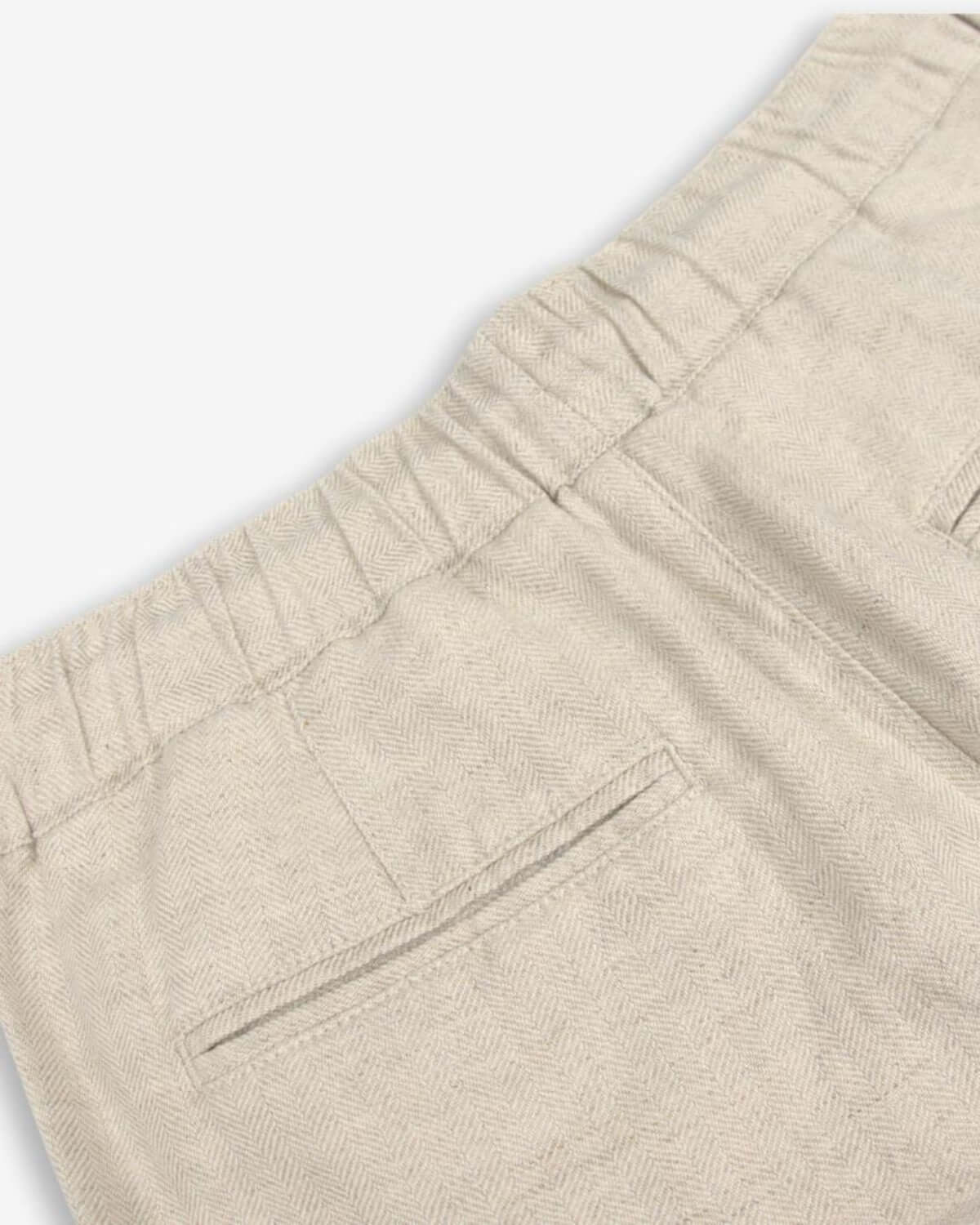 Relaxed fit and adjustable waistband of the Sand Linen Resort Pant for stylish, adventure-ready kids!